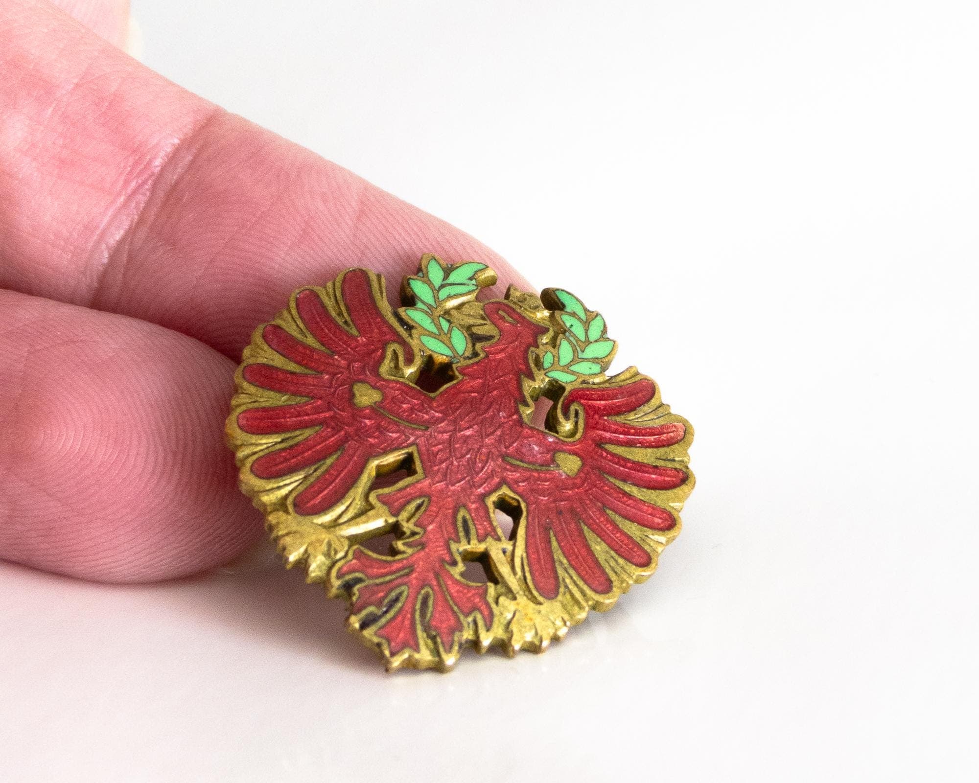 antique cap badge austro-hungarian wwi tyrolean red eagle – gilded metal & red enamel