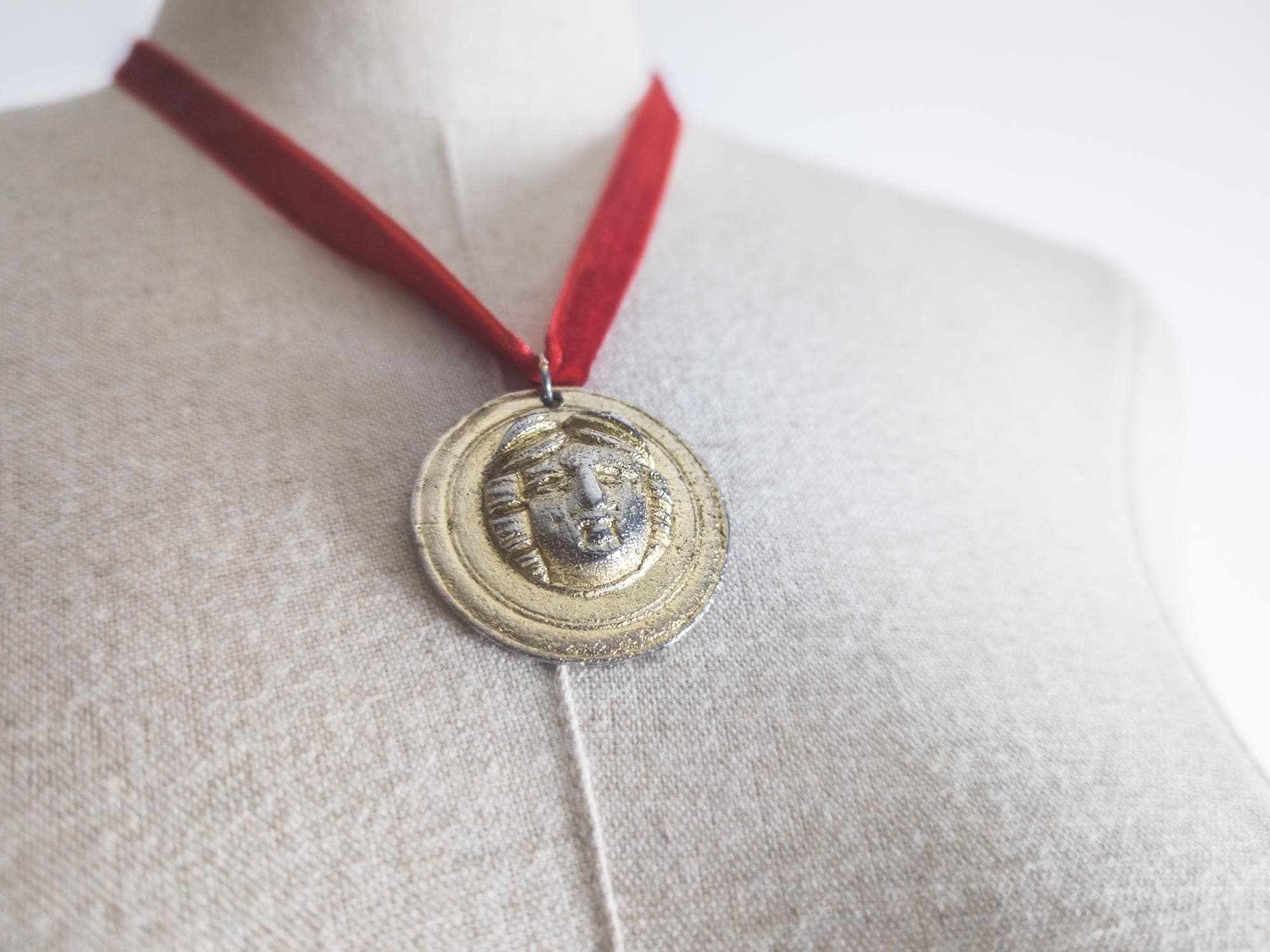british vintage sphinx lady pendant rare medusa head gold tone. signed "Sphinx 1971, numbered 3835, AR, ©, 2" without chain medusa medallion
