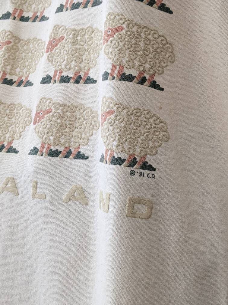 black sheep t-shirt vintage 1990s graphic tee New Zealand spell out, signed ©'91 C.D., creamy cotton, single stitch, ribbed crew neck - image 5