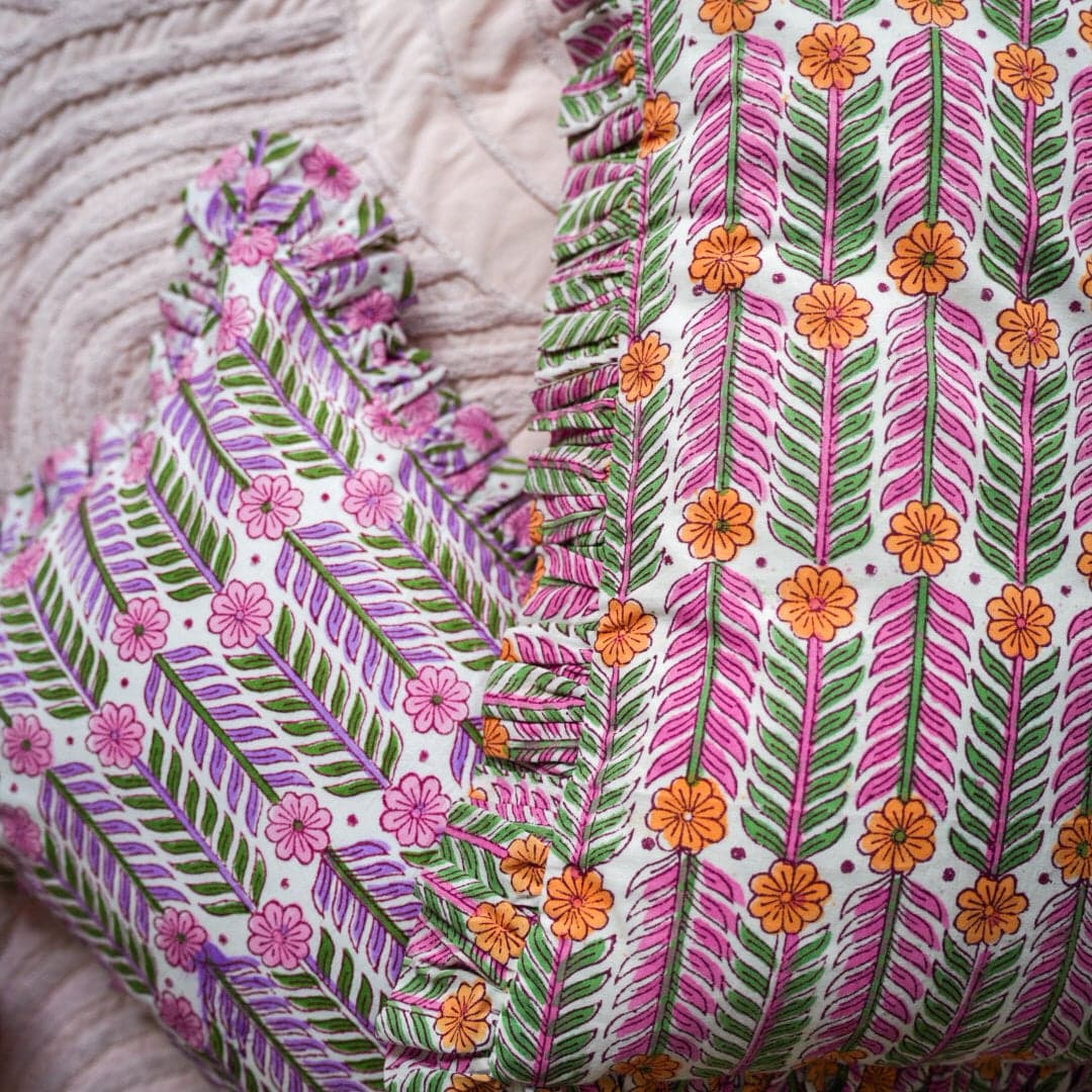 Handcrafted cushion adorned with intricate hand block prints in a lively bohemian style, bursting with an array of vibrant and colorful hues