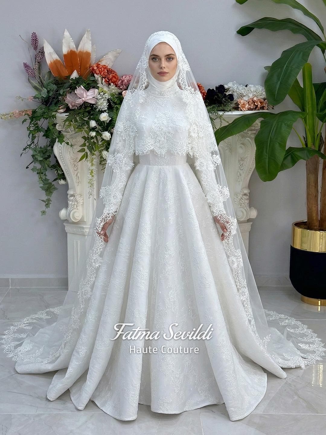 Elegant hijab wedding dress with long sleeves, high neck, detachable lace cape, cathedral train, and premium lace veil included. Luxury modest bridal couture gown in white with floral lace detailing.