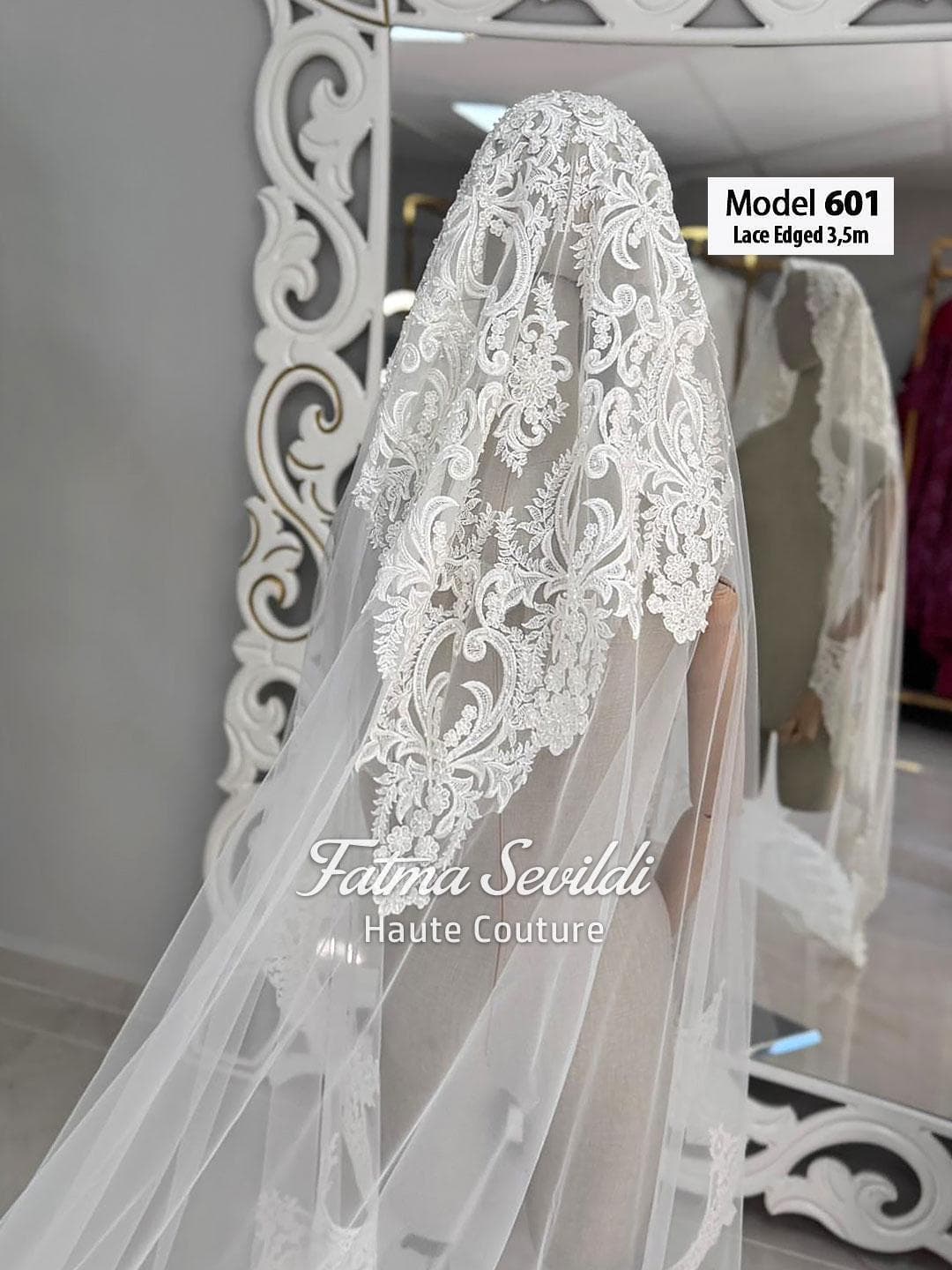 Cathedral lace edge bridal veil in soft ivory luxury tulle with hand-sewn appliqué detail, designed for elegant classic and modest bridal styling. Hijab-friendly long wedding veil with refined lace coverage and a timeless couture finish.