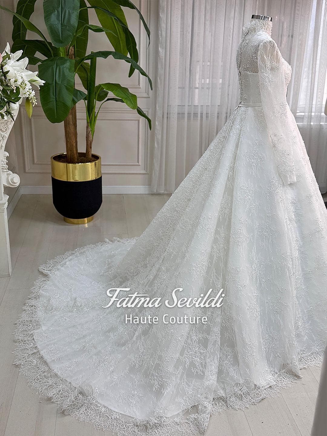 Veiled bridal set featuring a strapless beaded lace ballgown with corset back and full skirt volume, made to measure. Includes premium lace veil, headscarf, and petticoat for a couture wedding look.