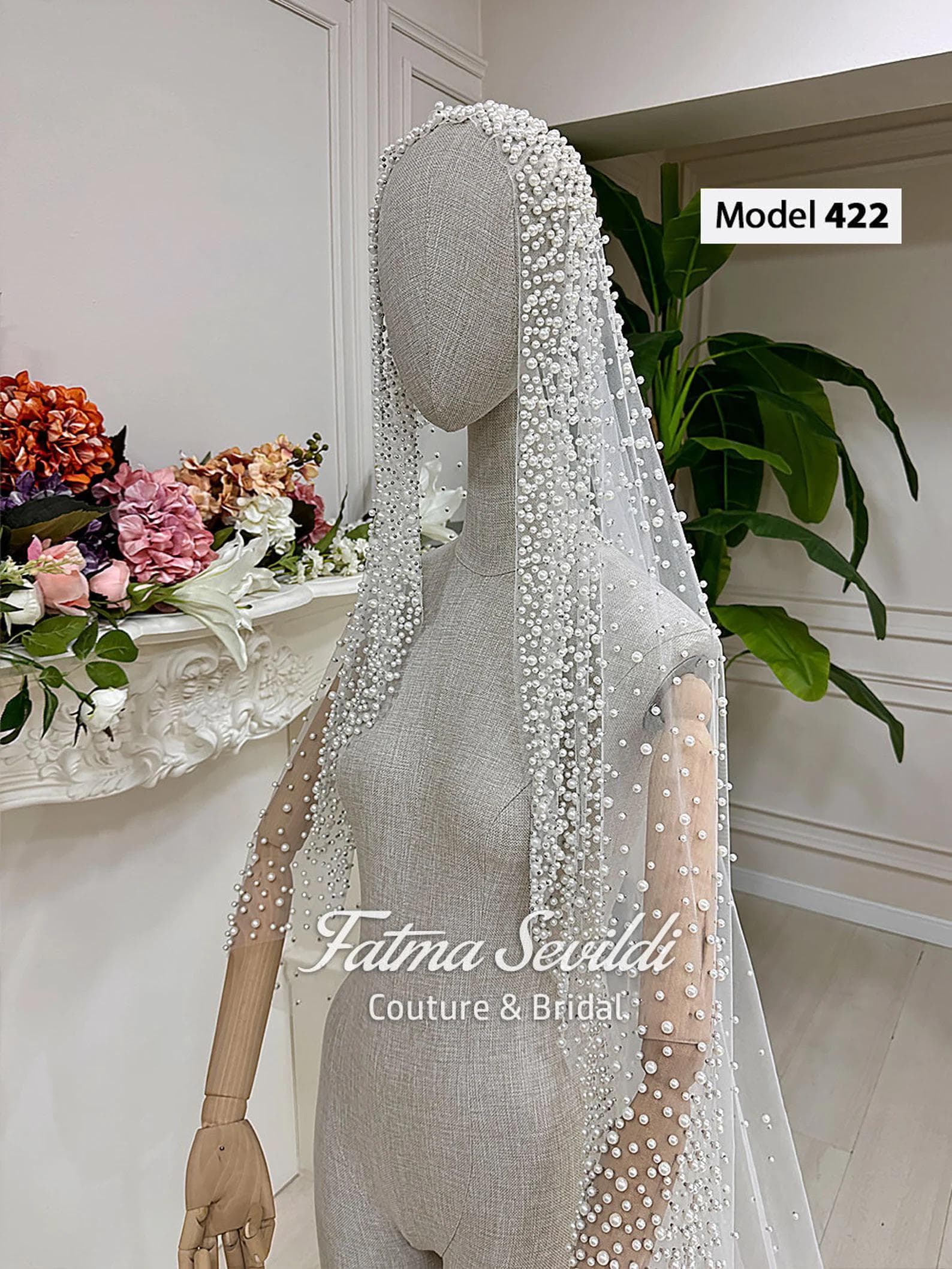 Pearl lace cathedral bridal veil in soft ivory tulle with hand-sewn beaded appliqué, designed for elegant classic and modest bridal styling. Hijab-friendly long wedding veil with refined lace detail and a timeless couture finish.