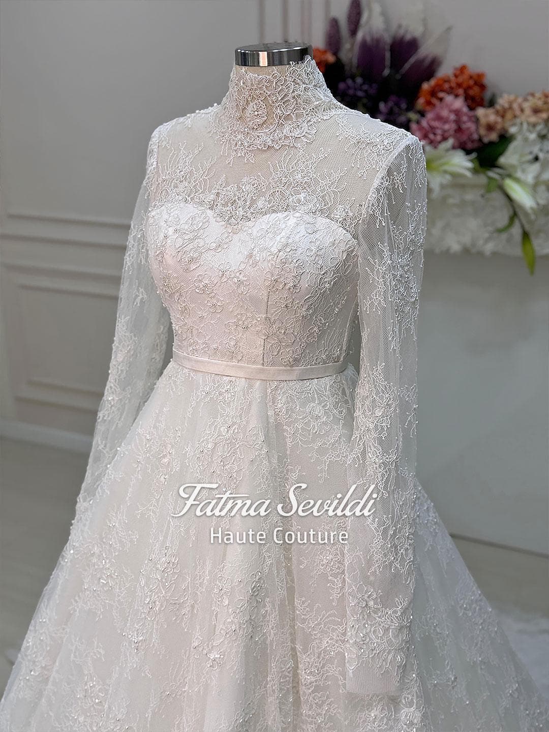 Veiled bridal set featuring a strapless beaded lace ballgown with corset back and full skirt volume, made to measure. Includes premium lace veil, headscarf, and petticoat for a couture wedding look.