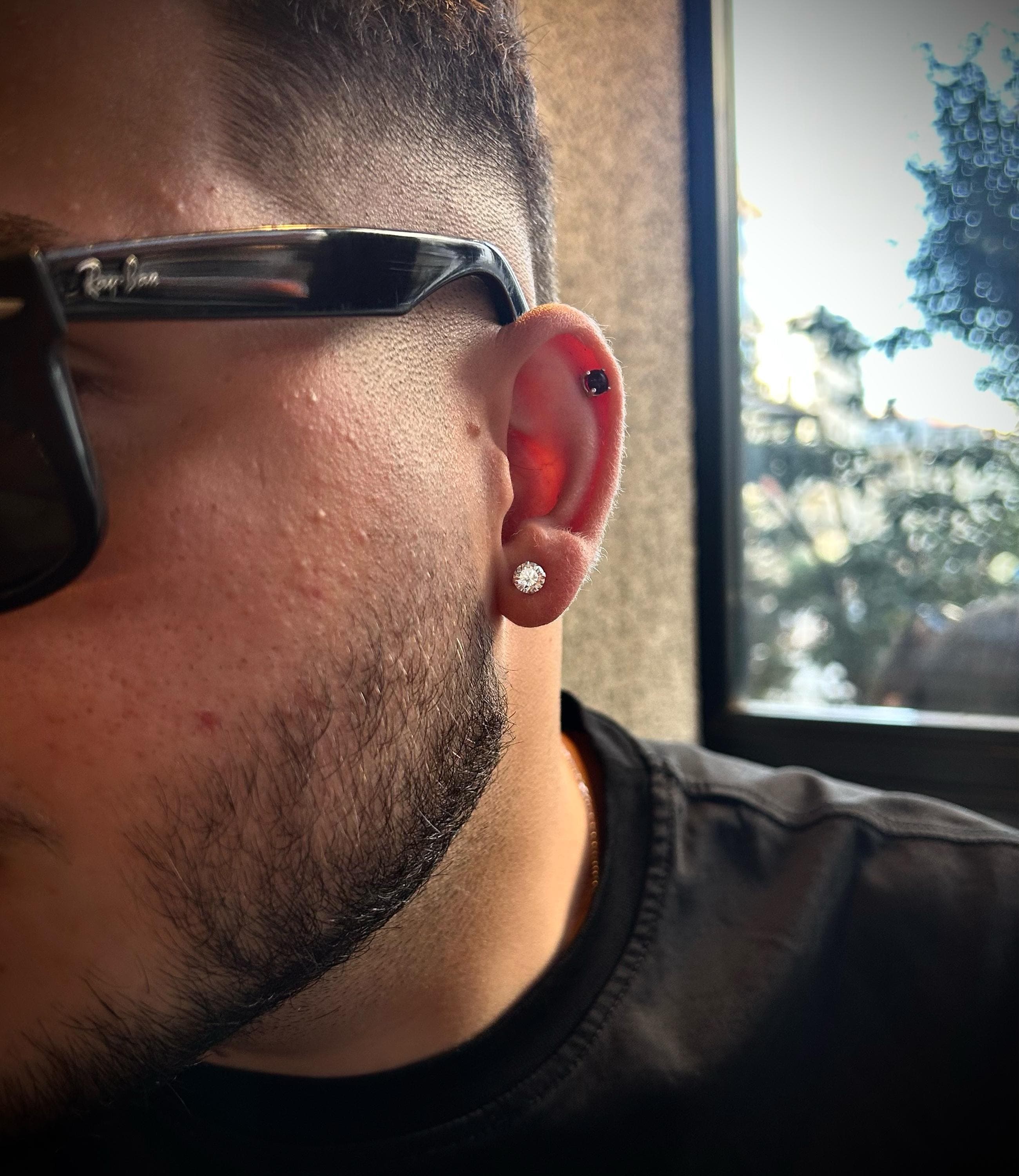 6mm CZ stud earrings for men in polished 925 silver, placed on a clean dark background with lighting focused on the sparkle, evoking Ronaldo’s signature footballer style.