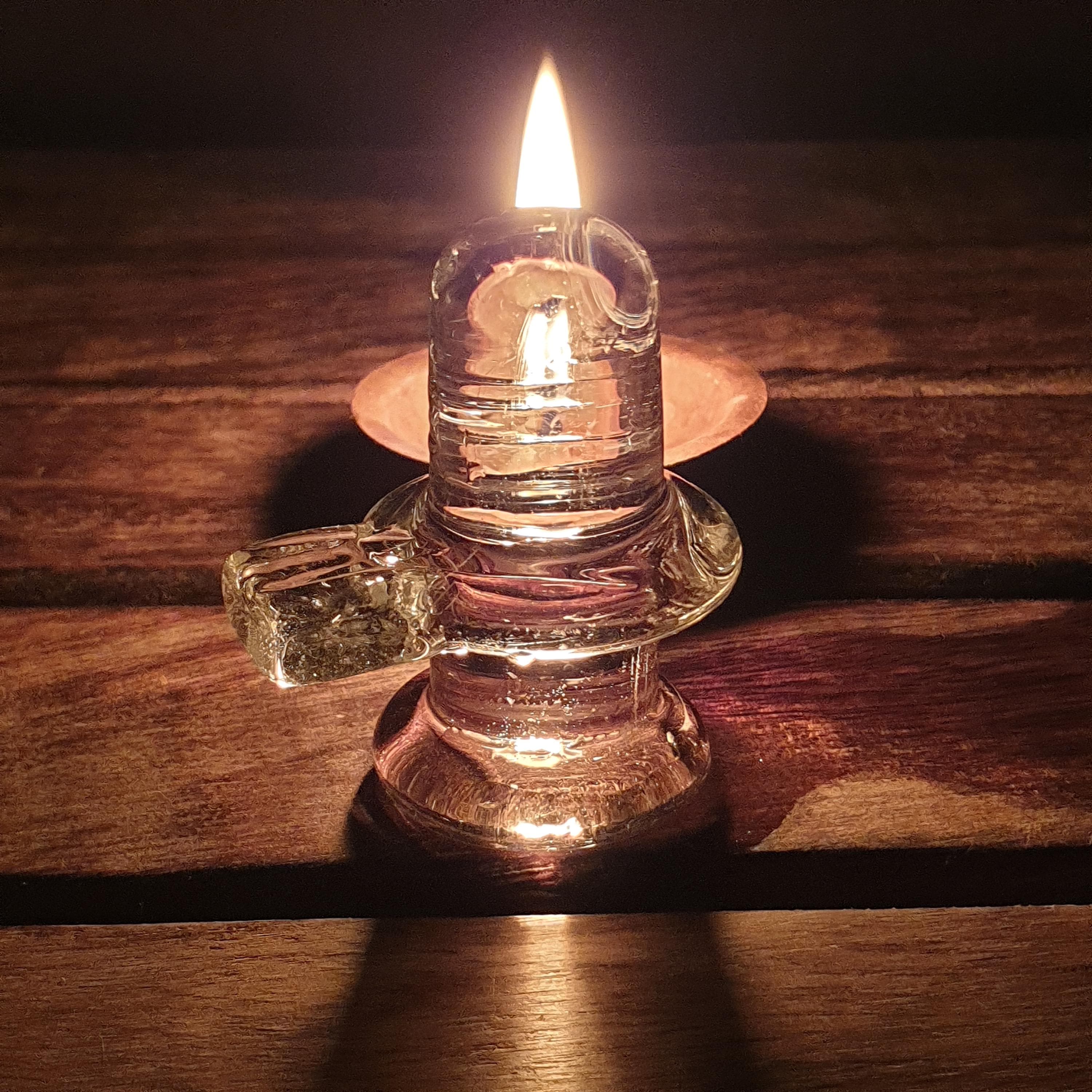 sphatik shivling,
crystal shiva lingam,
clear quartz lingam,
shiva lingam crystal,
hindu home temple,
shivling for pooja,	
 spiritual home decor,
meditation altar decor,
lord shiva idol,
 maha shivratri gift,
vastu healing crystal,
yoga room decor,
hindu religious gift