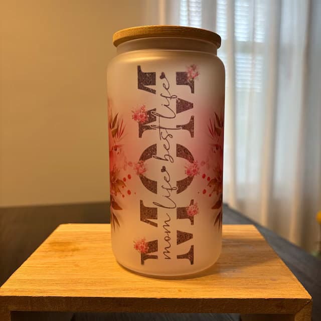 a glass jar sitting on top of a wooden table