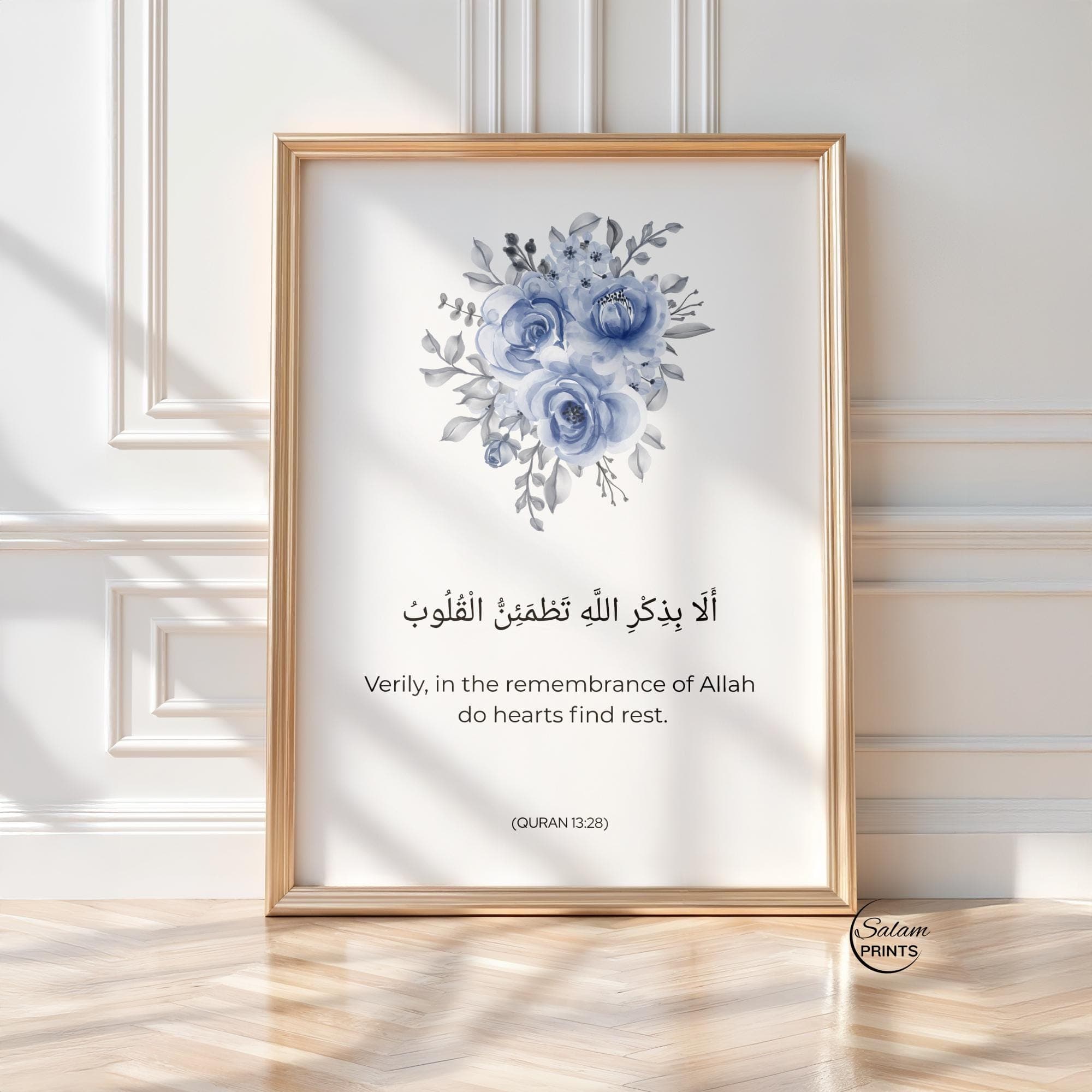 QURAN QUOTE ART , Minimalist WATERCOLOR FLOWERs IN blue on white background , BELOW IT IS WRITTEN QURAN VERSE - '' Verily in the remembrance of Allah do heart find rest.'' IN ARABIC CALLIGRAPHY AND ENGLISH TRANSLATION.