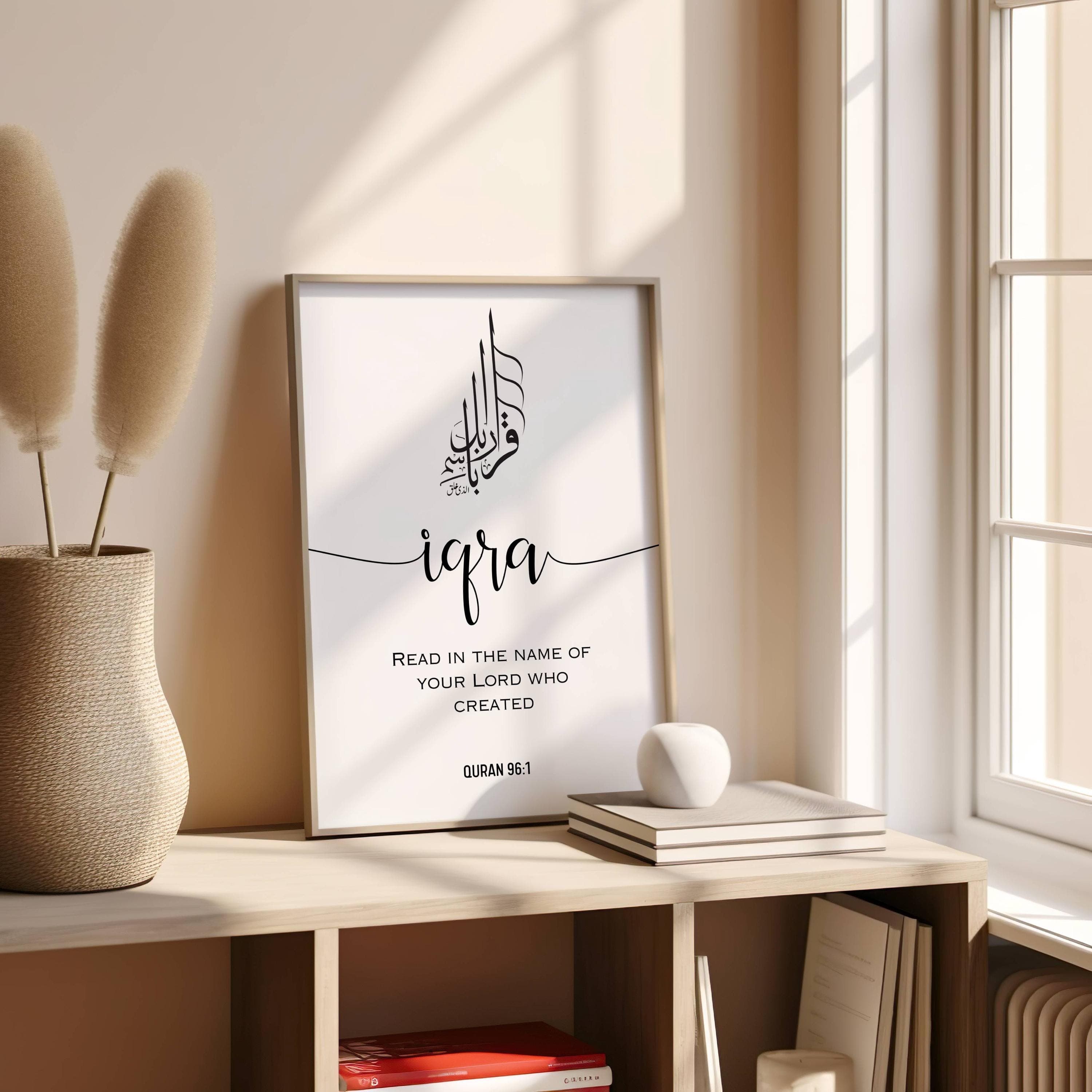 Minimalist Arabic calligraphy featuring the Quranic verse IQRA ;Read in the name of your Lord who created(Quran 96:1) in an elegant black-and-white design. Below it is written the full verse translation in engl;ish in capital easy to read letters this modern elegant fonts decor adds a modern touch, making it perfect for a study, prayer room, or living space. This Islamic digital download is ideal for Muslim home decor, Quran-inspired art, and unique Islamic gifts, bringing faith into any space.