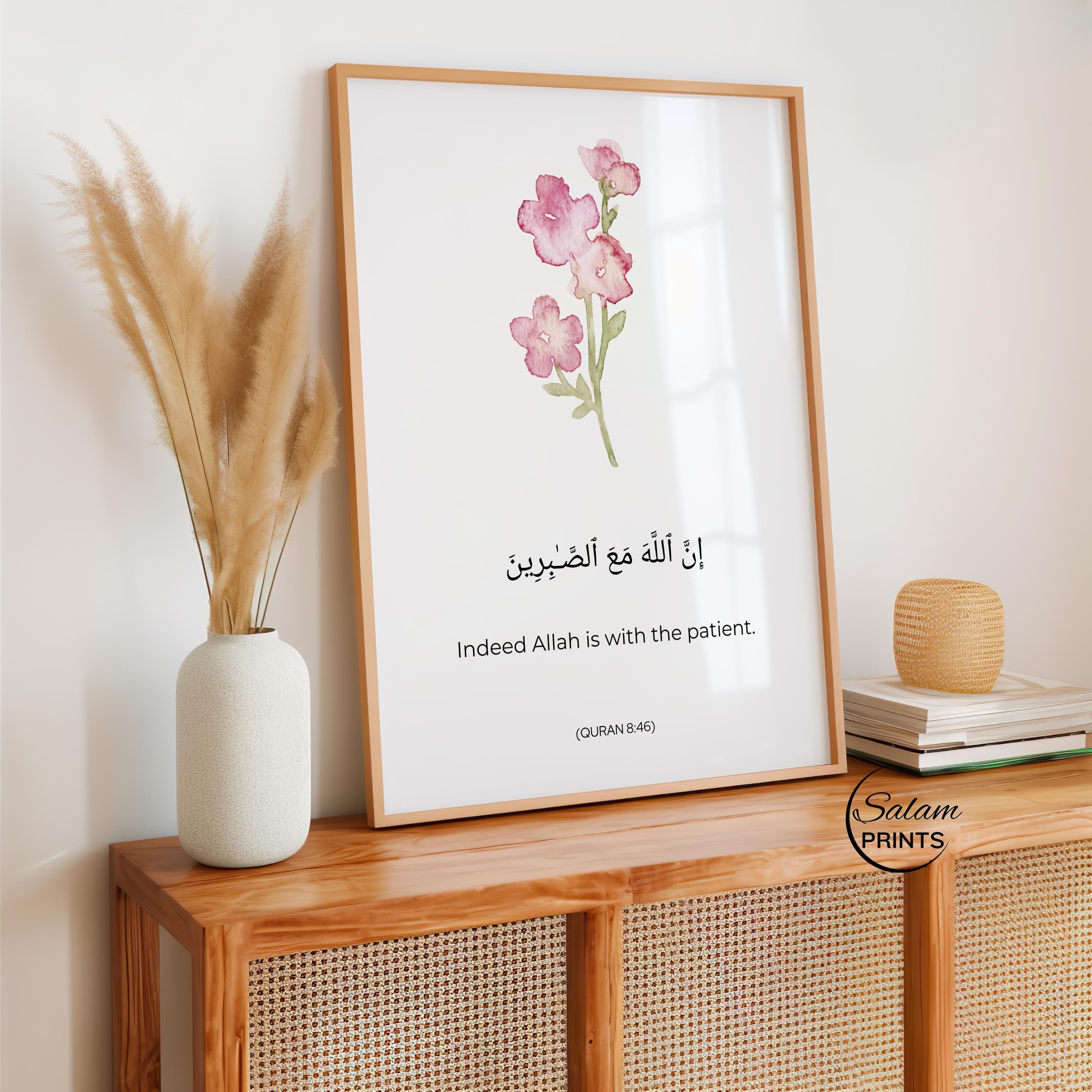 QURAN QUOTE ART , A WATERCOLOR FLOWER IN PINK AND GREEN , BELOW IT IS WRITTEN QURAN VERSE - '' INDEED ALLAH IS WITH THE PATIENT'' IN ARABIC CALLIGRAPHY AND ENGLISH TRANSLATION.