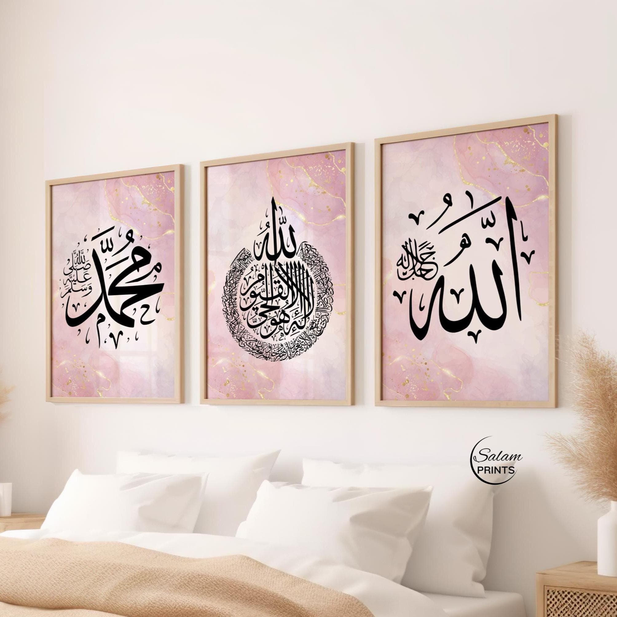 Three-piece Arabic calligraphy artwork featuring Ayatul Kursi and the names of Allah and Muhammad, beautifully written in black on a pink and gold marble abstract background.