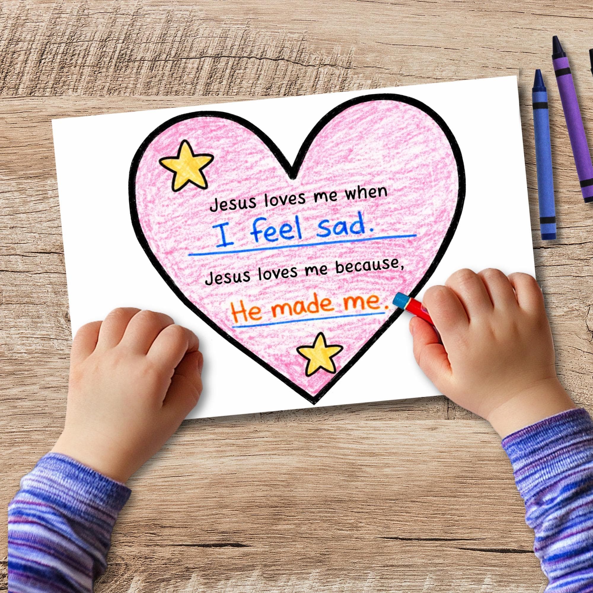 Finished heart craft activity for kids featuring โJesus loves meโ writing prompt, faith based coloring and scripture lesson printable.