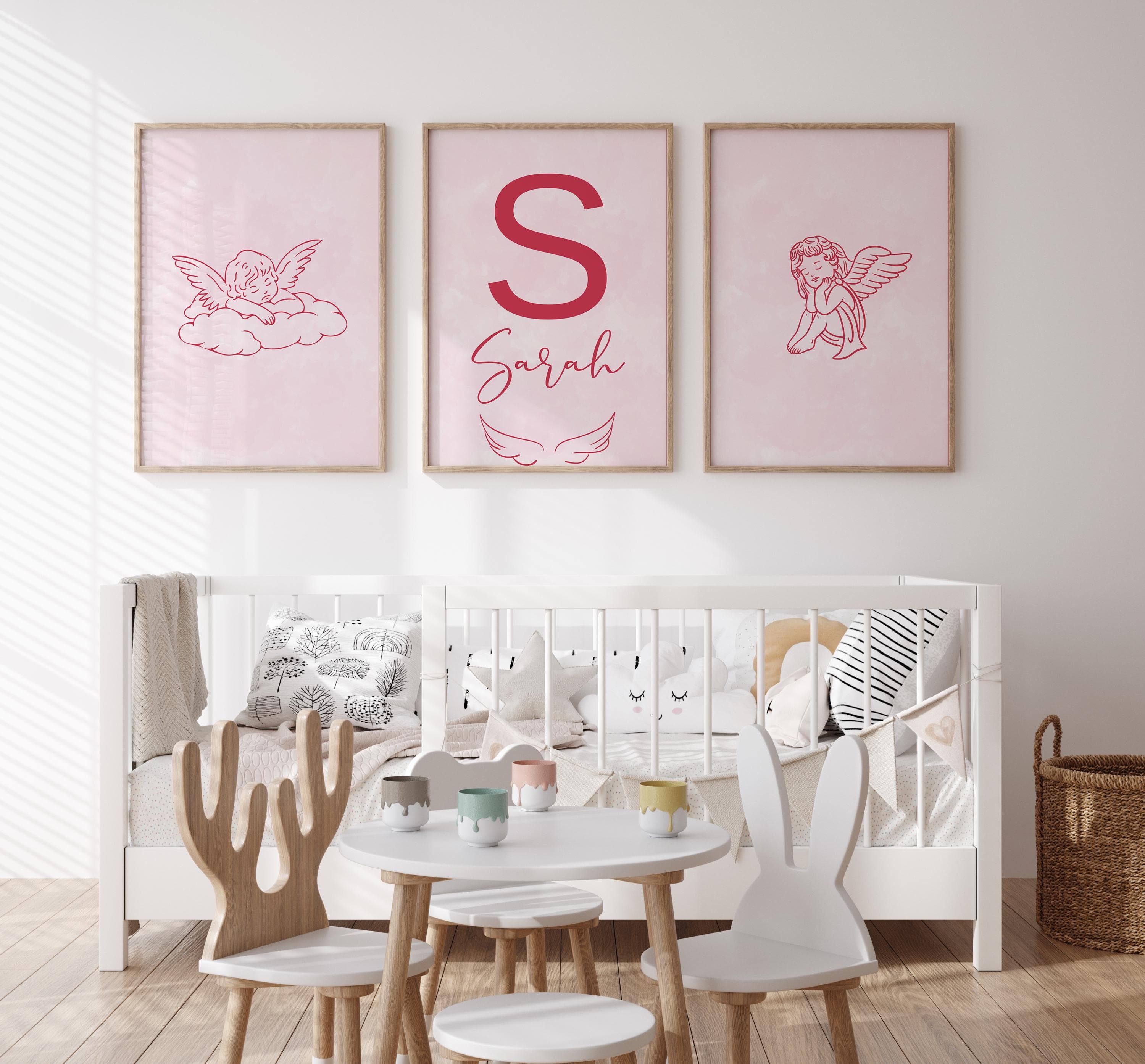 Soft pink angel design for nursery wall decor.