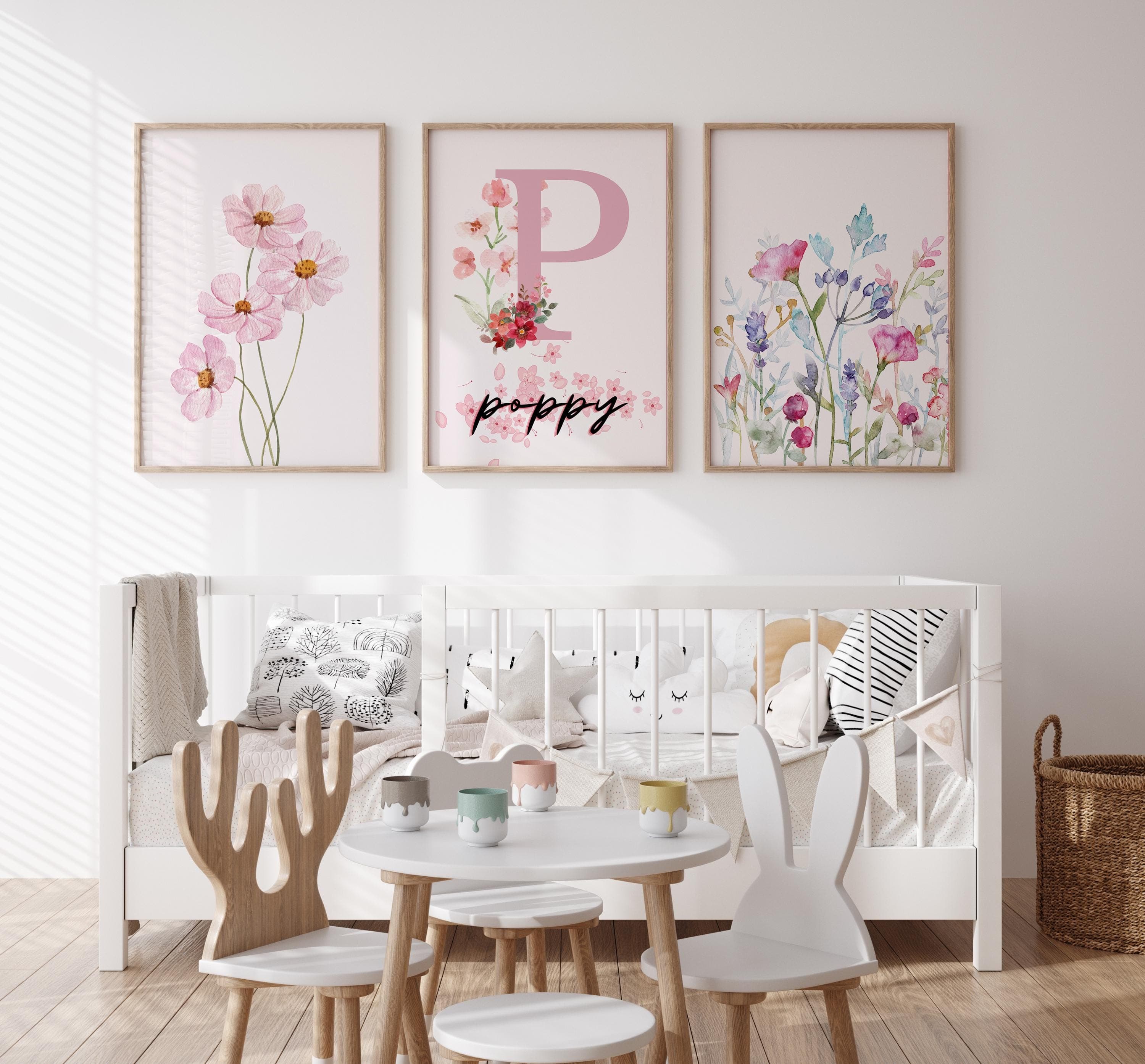 Pink and pastel floral prints for children’s room decoration.