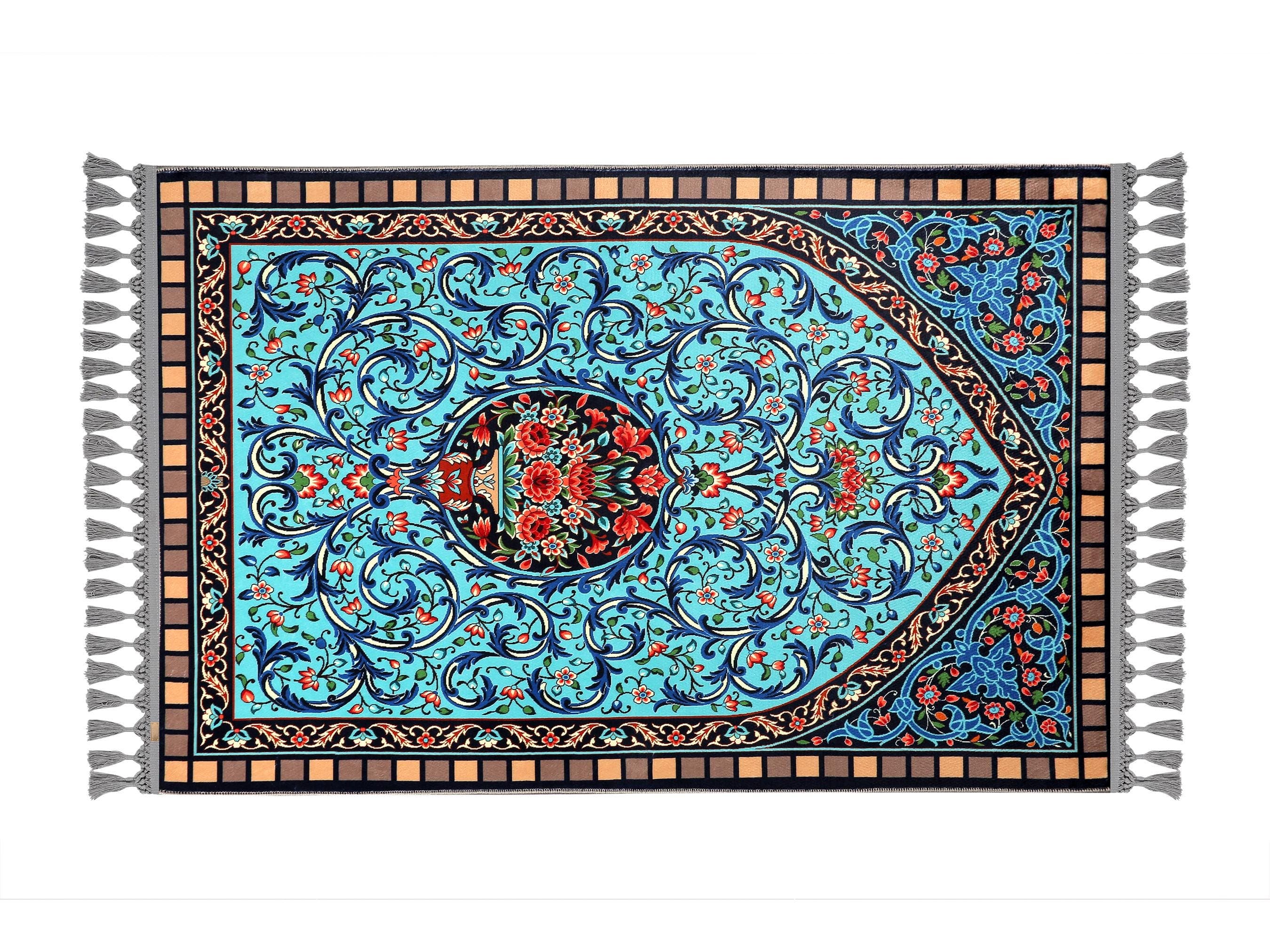 Turkish prayer rug with a blue floral Ottoman mihrab design, made of soft cotton woven base with non-slip backing. Measures 80x125 cm (31.5"x49.2"), 7 mm thick, and weighs 1.738 kg. Inspired by classical Ottoman architecture and Islamic floral art, it showcases elegant style with hand-knotted fringes. Ideal for daily prayers at home, travel, or mosque. A meaningful gift for weddings, Ramadan, Eid, or Hajj. Optional name personalization and custom sizing available.