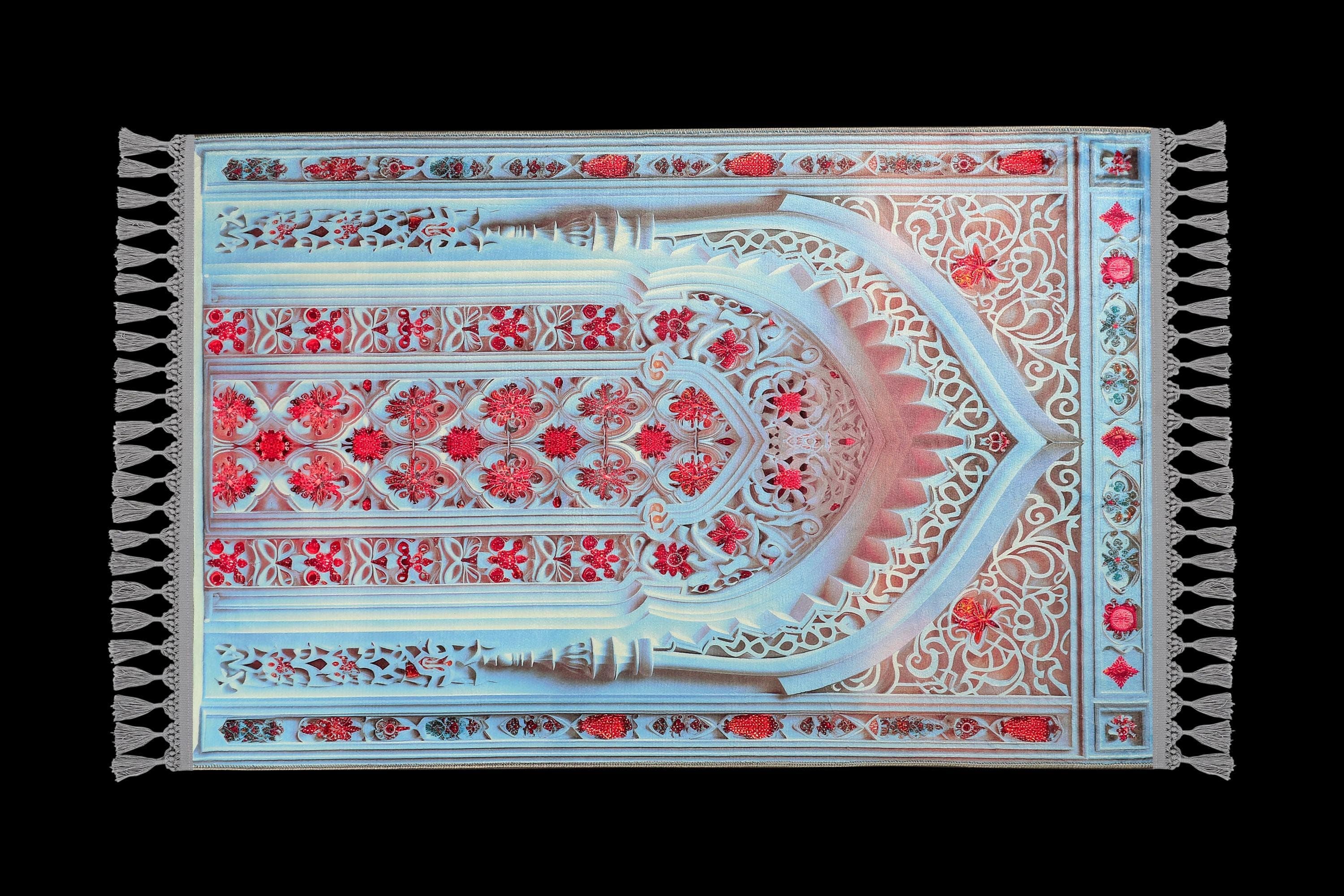 Turkish prayer rug with a blue and red mihrab design, made of soft cotton woven base with non-slip backing. Measures 80x125 cm (31.5"x49.2"), 7 mm thick, and weighs 1.738 kg. Inspired by Islamic architectural motifs, it showcases elegant style with hand-knotted fringes. Ideal for daily prayers at home, travel, or mosque. A meaningful gift for weddings, Ramadan, Eid, or Hajj. Optional name personalization and custom sizing available.