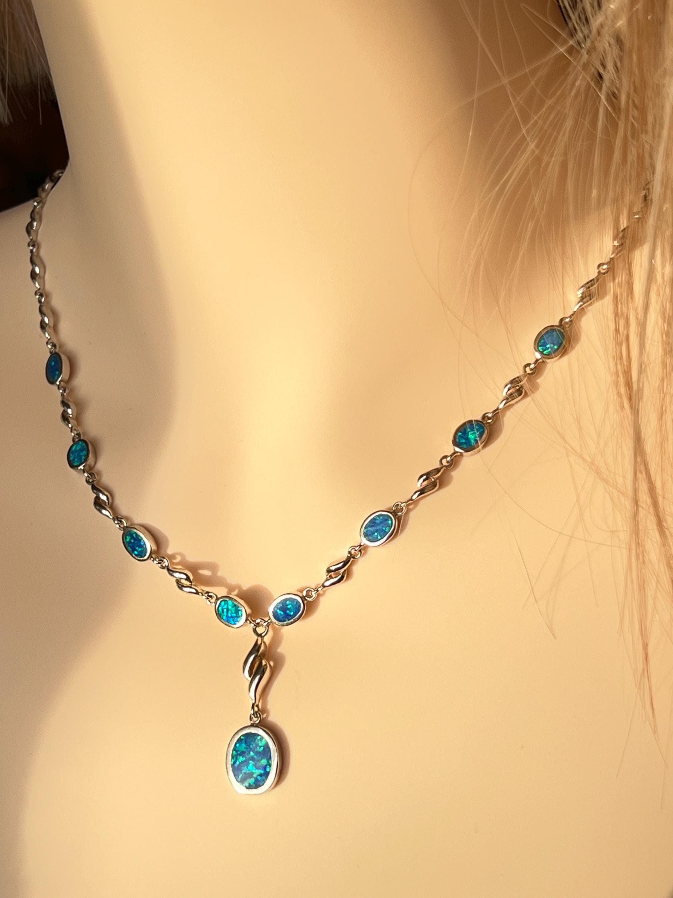 Vintage 1980s Y‑necklace in 925 sterling silver with synthetic blue opal stones, featuring oval bezel‑set opals and twisted silver links with a central drop pendant.