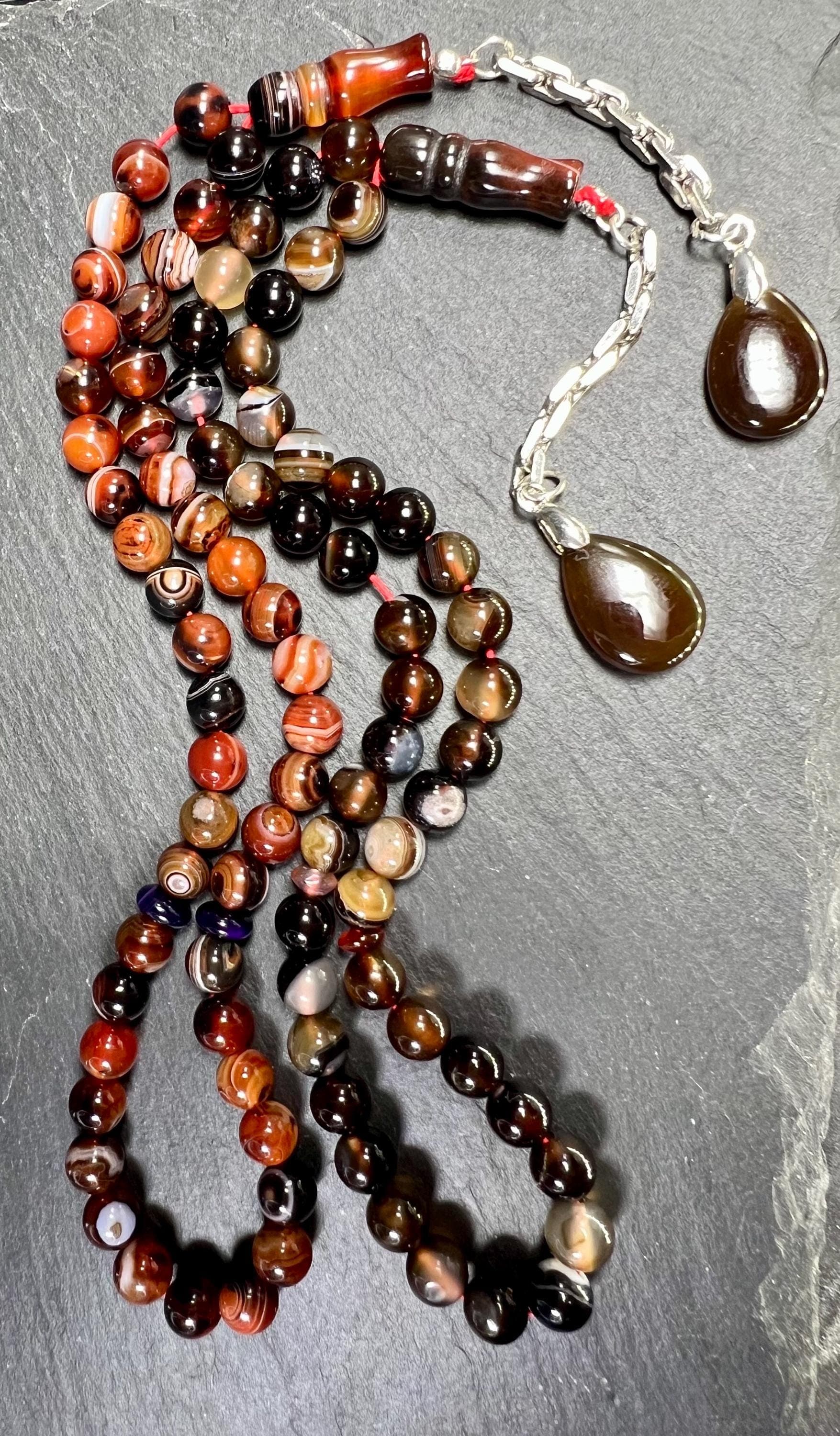 Natural Agate Tasbih with 45 beads (8mm), finished with a 925 sterling silver tassel and a drop shape agate pendant. AkueShop Products