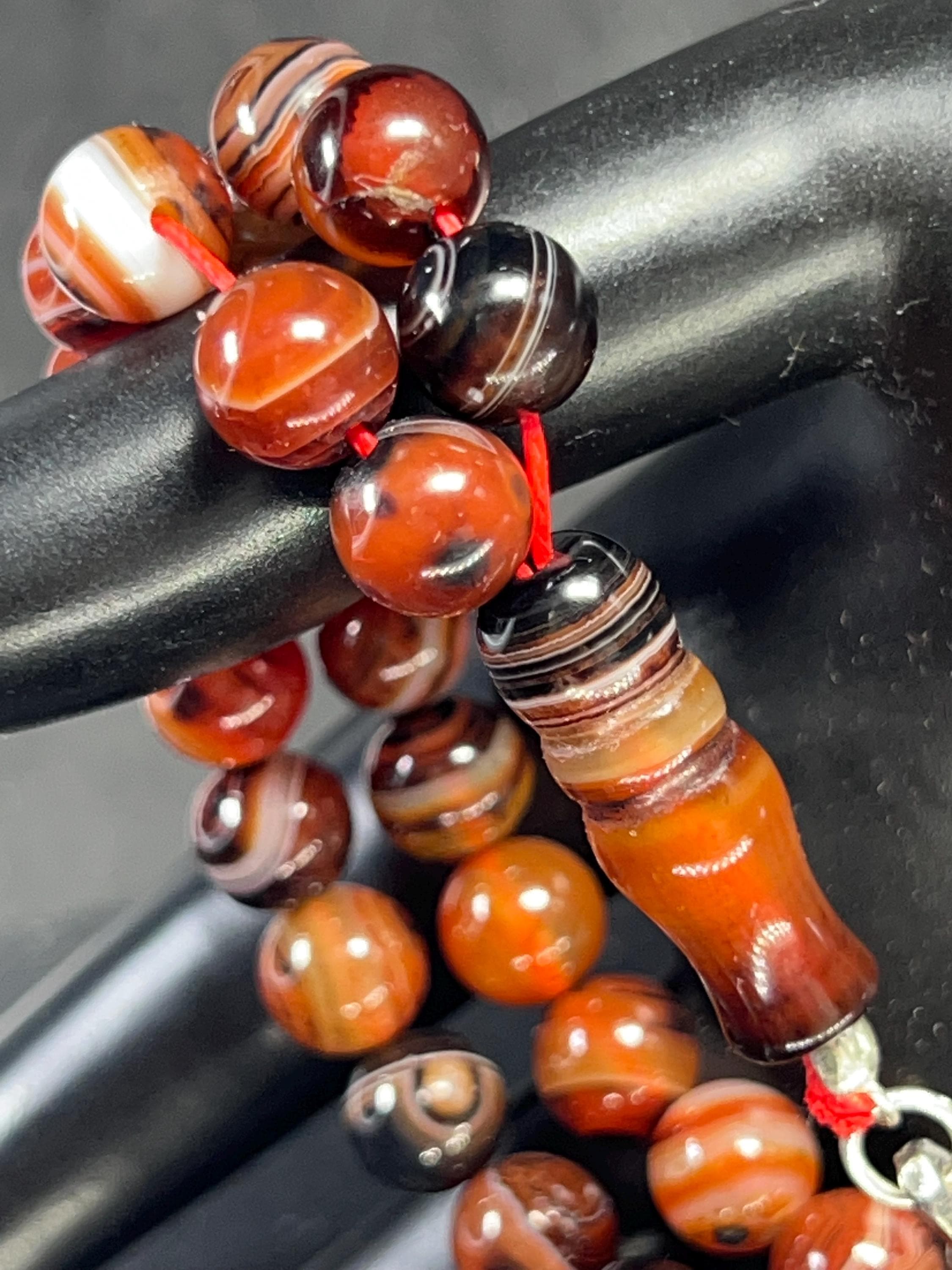 Natural Agate Tasbih with 45 beads (8mm), finished with a 925 sterling silver tassel and a drop shape agate pendant. AkueShop Products