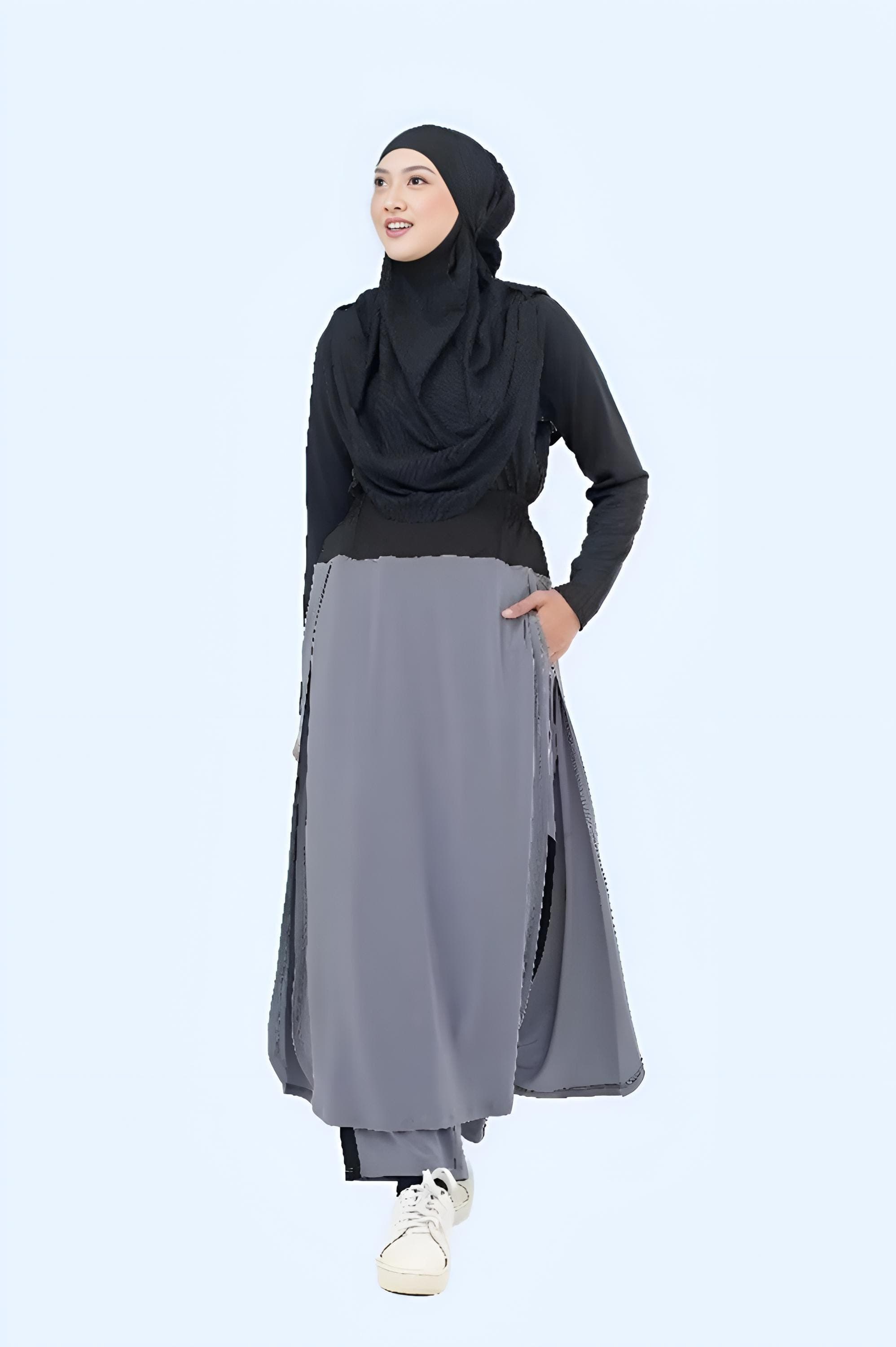 Woman wearing black multifunctional sports khimar hijab made of polyester spandex drifit fabric, quick dry and breathable