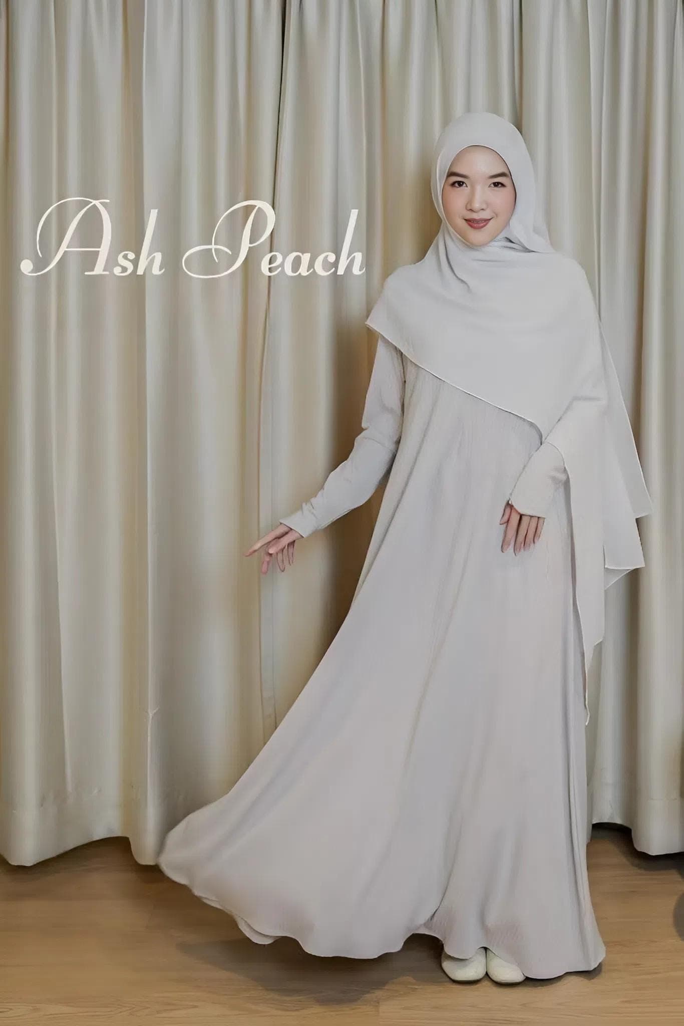Woman wearing modest knit abaya set in choco blush color, made from Freya Knit fabric, flowy ironless material with wudhu and nursing-friendly zipper.