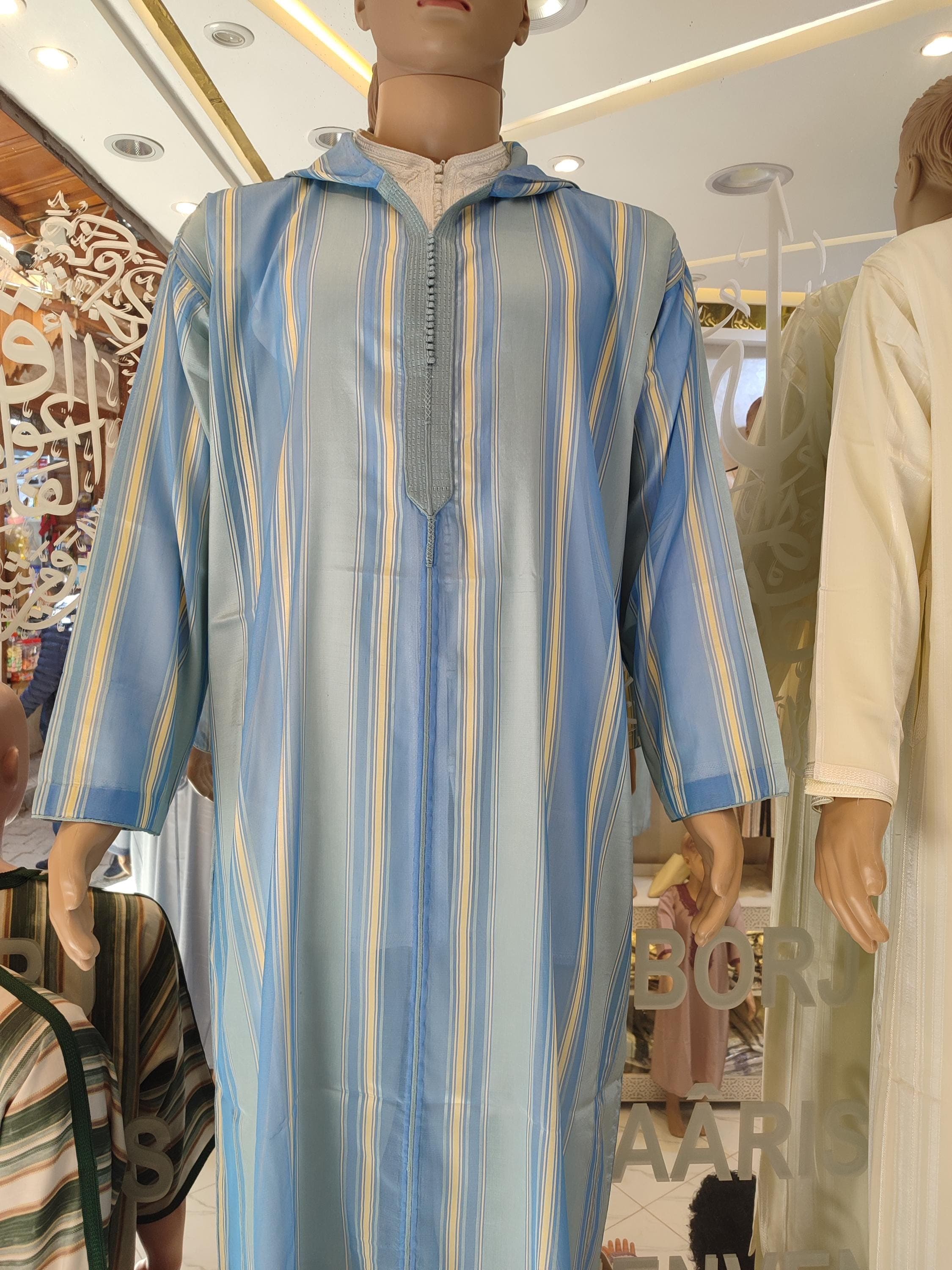 A premium blend of style, tradition, and spirituality, this djellaba dress is the ultimate Moroccan outfit for the modern man. With its hood, classic sousdi cut, and wool fabric, it doubles as a Moroccan kaftan, thobe for men, or jubba for special Islamic occasions. Ideal for Friday prayers, Ramadan nights, or as a Muslim men thawb for Eid. Whether you seek a gift for man, a practical prayer jubbah, or a timeless kaftan for men, this jalaba answers with grace and heritage.