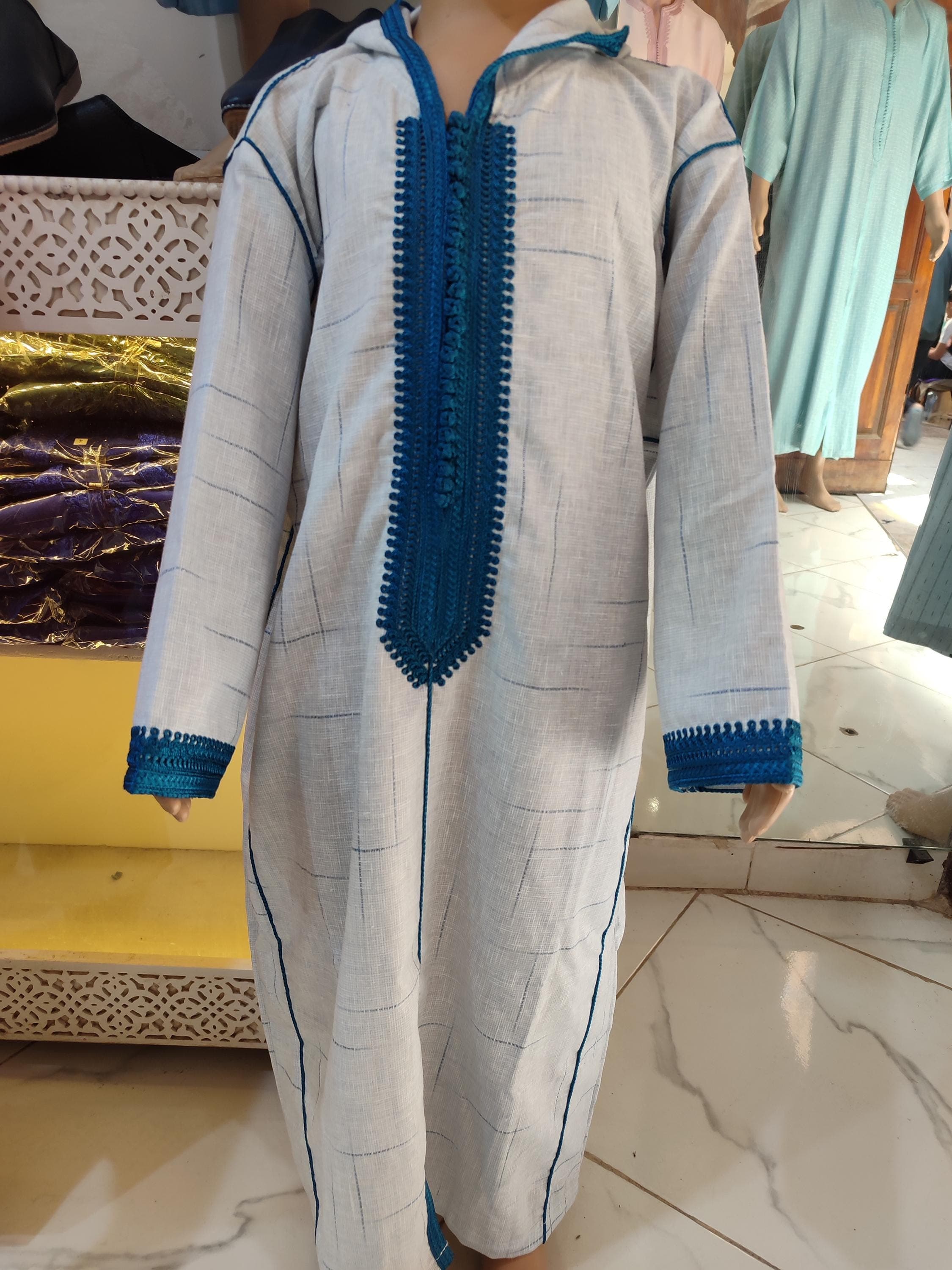 This exquisite boys jabador is the perfect Eid outfit for kids and a cherished gift for aqiqah celebrations. Handcrafted with soft, premium fabric, it features delicate embroidered details on the collar and cuffs, inspired by Moroccan traditional clothing. The classic jabador baby boy design ensures both comfort and elegance, allowing your little one to celebrate in style. Ideal for boys Eid dress occasions, family photos, and special ceremonies. It’s more than clothing