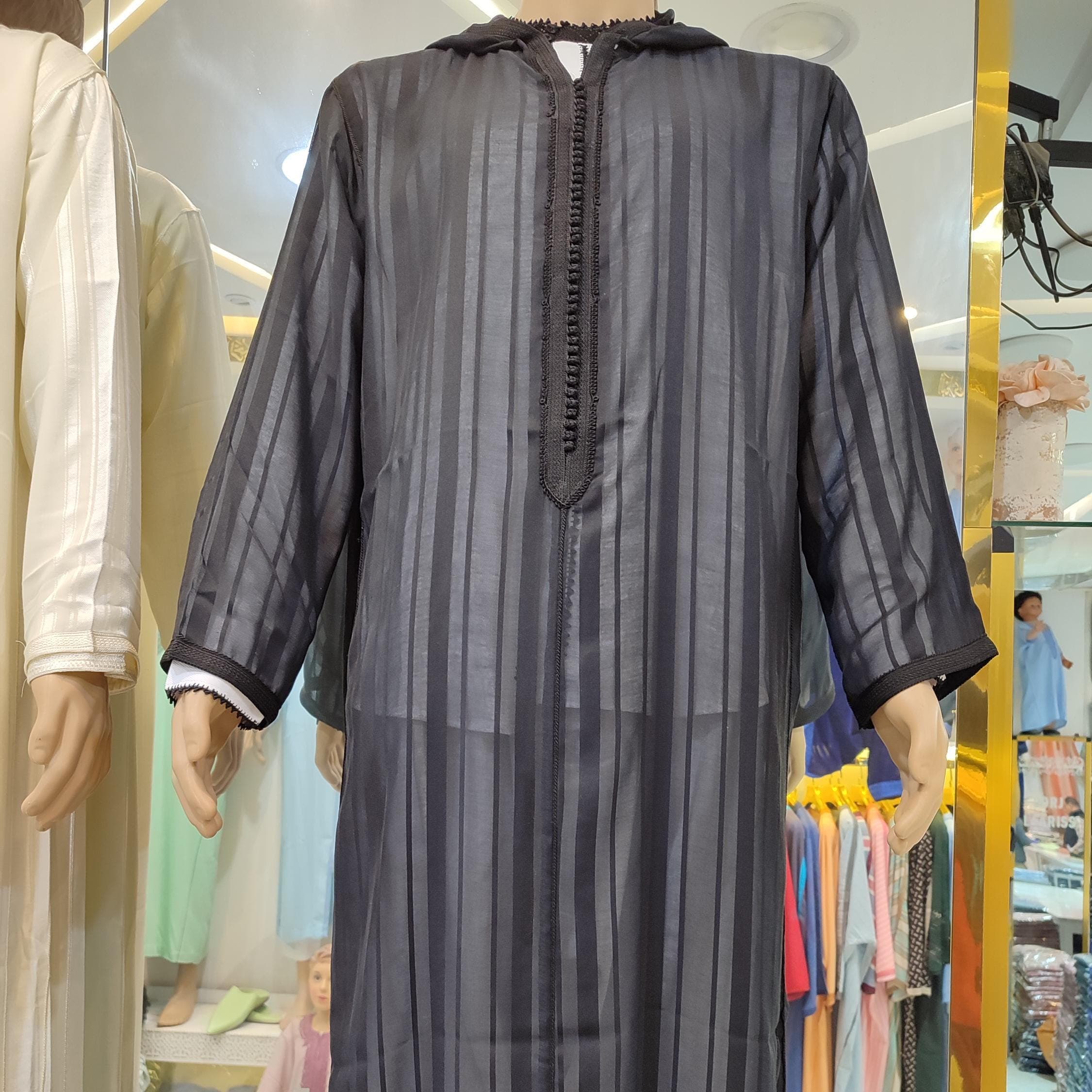 This lightweight djellaba cotton piece is perfect for year-round comfort. The djellaba dress features a relaxed fit with traditional Moroccan hoodie styling, making it suitable as both a jilbab for daily wear and special occasions. Handcrafted with attention to detail, this jalabiya showcases authentic Moroccan design with modern functionality. The breathable fabric and classic silhouette make this djellaba men garment a wardrobe essential for those who appreciate modest, comfortable fashion.