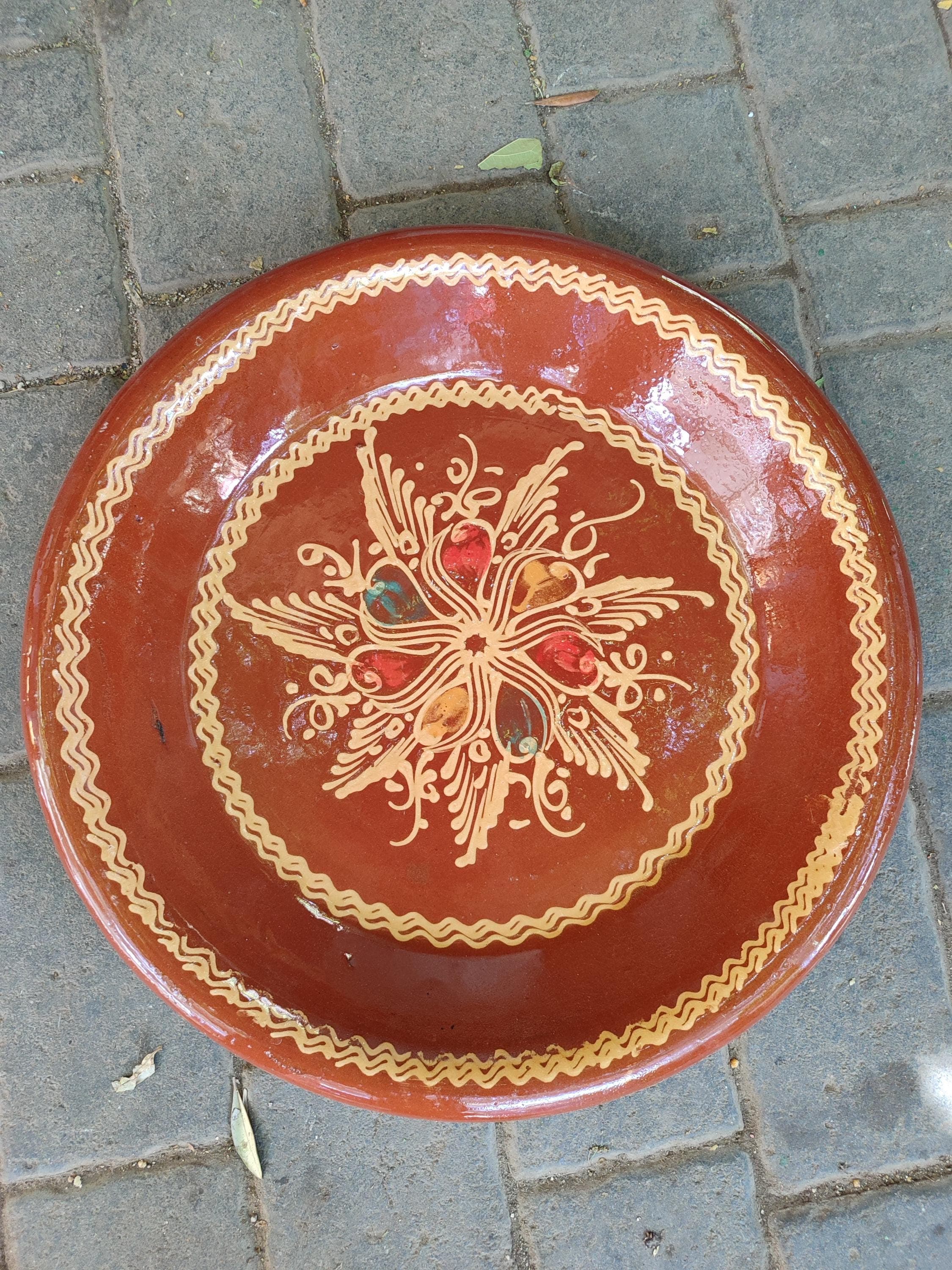 handcrafted Kesriya. This clay cooking pot and serving dish is central to Moroccan cuisine, specifically designed for serving fluffy couscous the national dish. The antique styling and robust clay construction reflect the timeless beauty of Marrakech cooking. Use it as a stunning couscous bowl for festive occasions or as a beautiful fruit platter. This Moroccan bowl is a perfect gift for foodies and lovers of global culinary traditions.