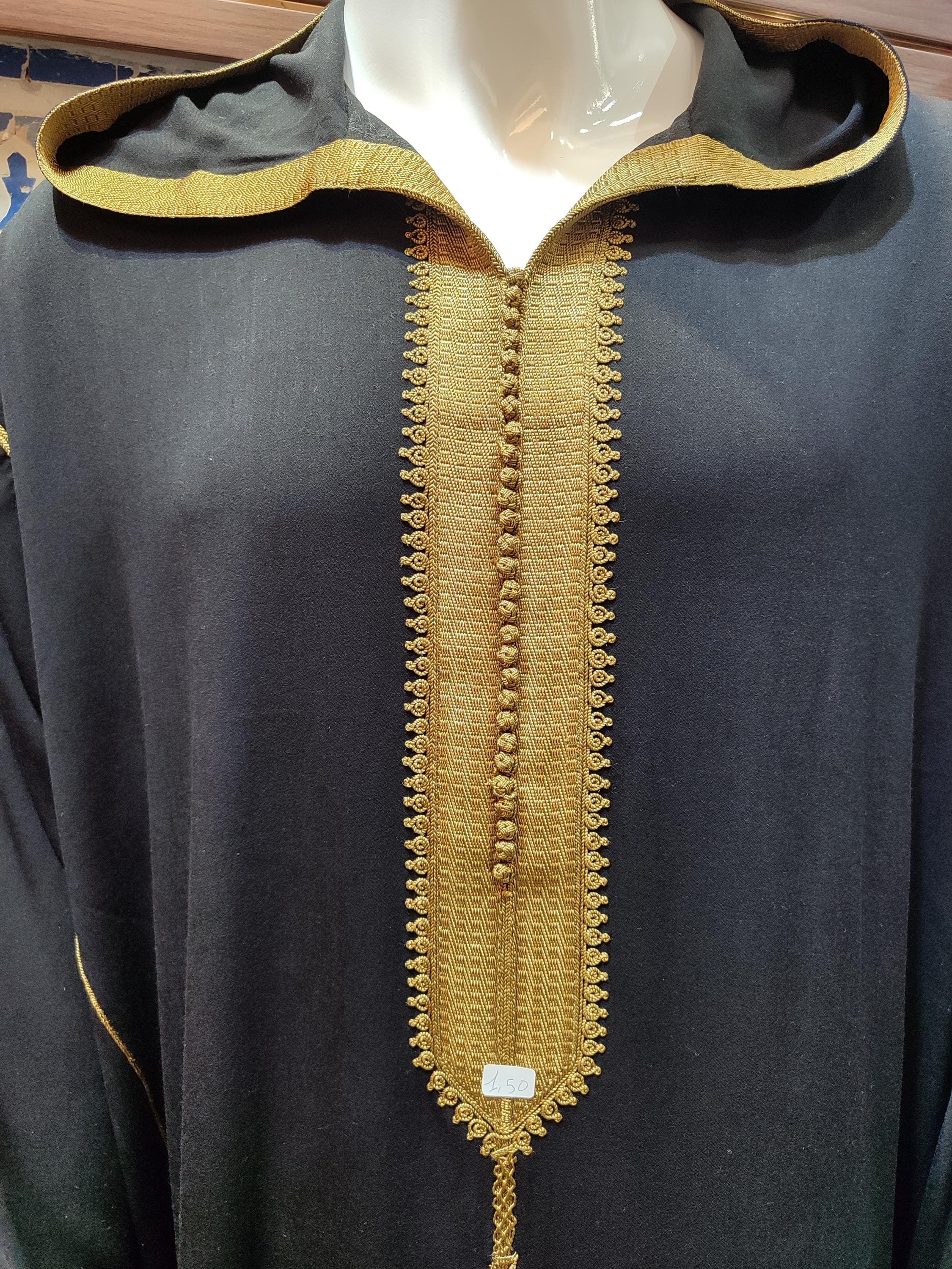 Crafted from high-quality wool, this Moroccan thobe offers warmth and comfort during cooler seasons. The hooded design and long length make it perfect for daily wear or special events like Eid and Islamic prayers. The minimalist yet elegant style suits both formal and casual settings. This wool jalabiya is handmade with precision, reflecting the rich heritage of Moroccan craftsmanship. Its versatile design pairs well with traditional accessories, making it a timeless addition to any wardrobe.