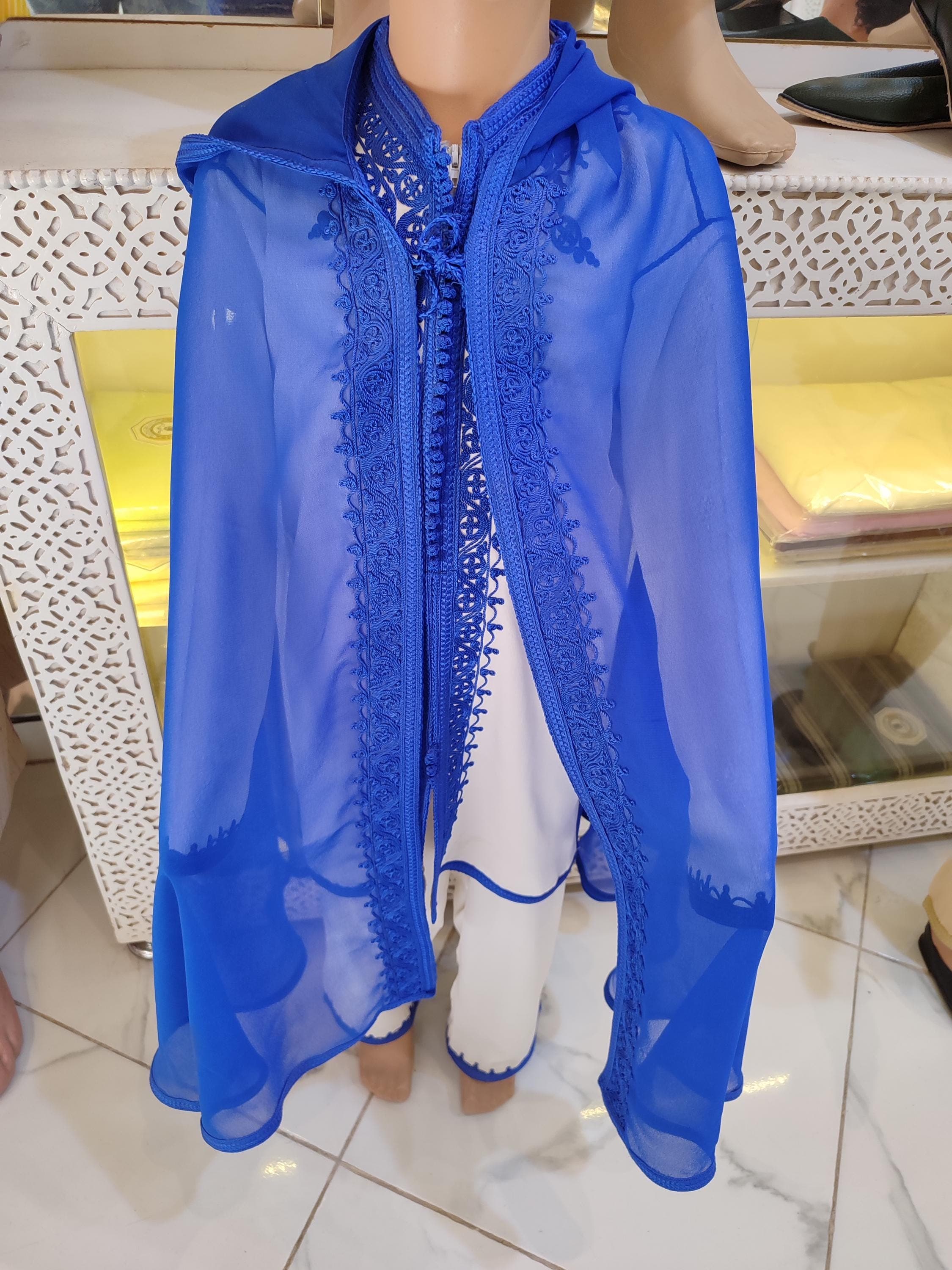 Exquisite girl Eid dress featuring traditional Moroccan embroidery on luxurious fabrics. This kids boutique quality outfit includes a beautifully decorated jalabiya with matching belt. Designed for special occasions, our cultural clothing combines authentic craftsmanship with child-friendly comfort. The breathable materials and modest design make it perfect Islamic kids wear for celebrations