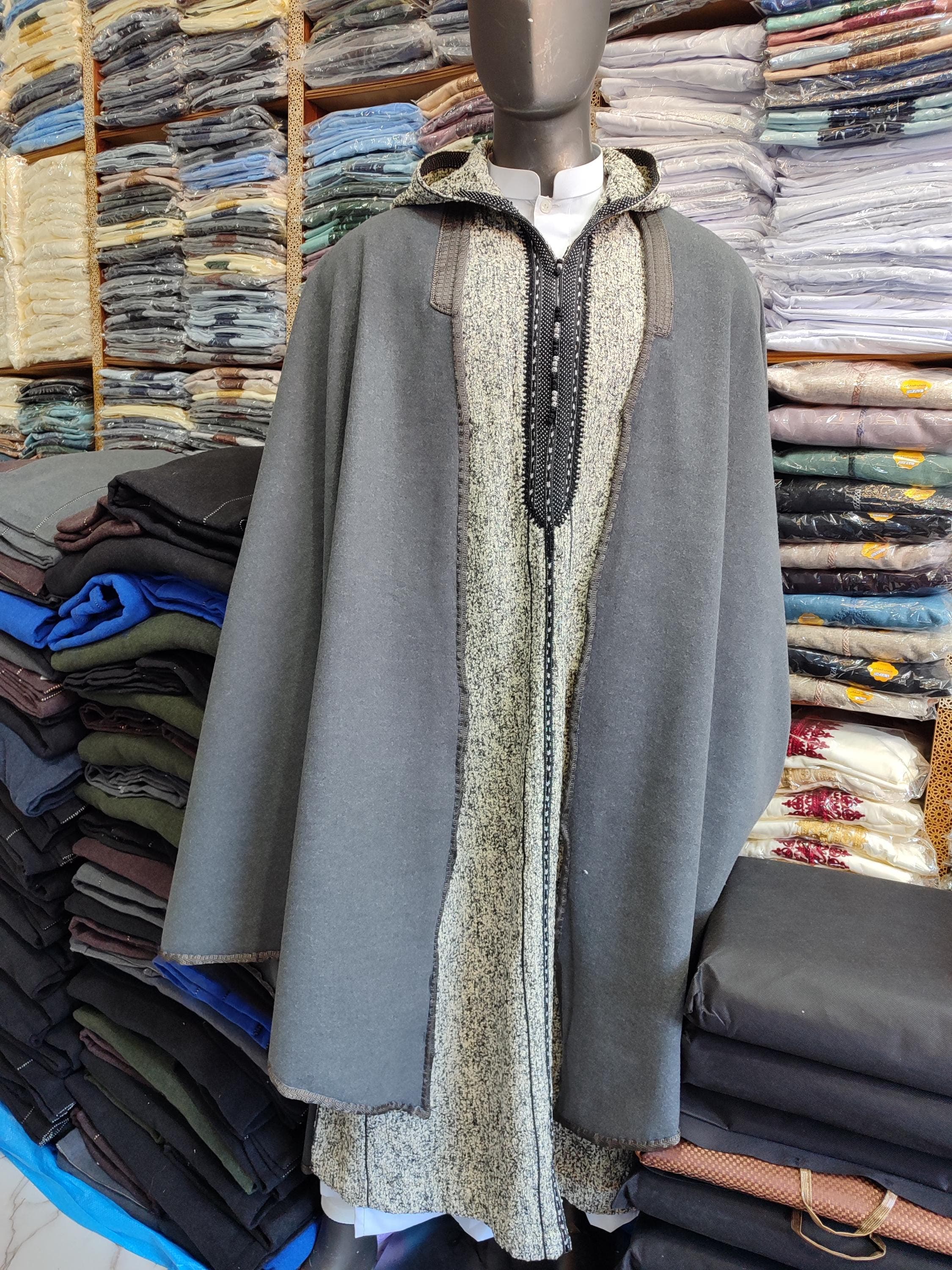 This complete Winter Djellaba Set includes both the traditional djellaba and matching Selham (hooded cloak), crafted from premium warm cotton for maximum winter comfort. The hooded thobe for men features authentic Moroccan thobe tailoring with reinforced seams and traditional closures. Perfect as Moroccan winter wear, this cotton djellaba offers both style and functionality. The classic gray color and hooded djellaba design make it ideal for daily use or special occasions.