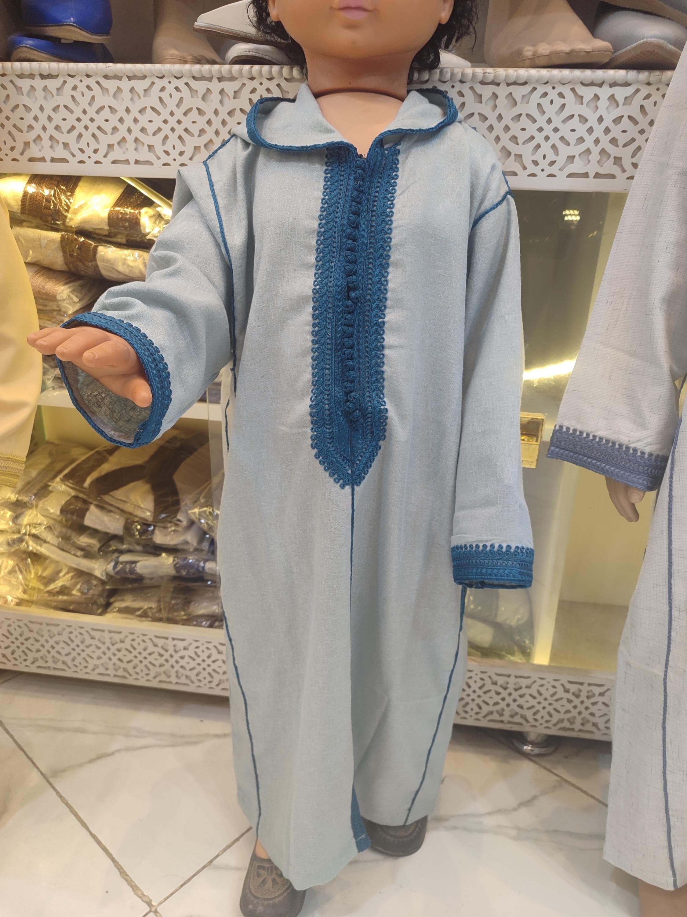 Prepare for Eid al Fitr 2025 with this stunning Moroccan wool caftan for boys, designed to make your little one look his best on this blessed occasion. This wool kids caftan features the traditional hooded jalaba kids design with intricate embroidery along the neckline and hood. As a boys Moroccan jalaba, it represents authentic Moroccan traditional dress craftsmanship passed down through generations. The warm wool fabric makes it ideal for ramadan outfit boys during cooler evening prayers