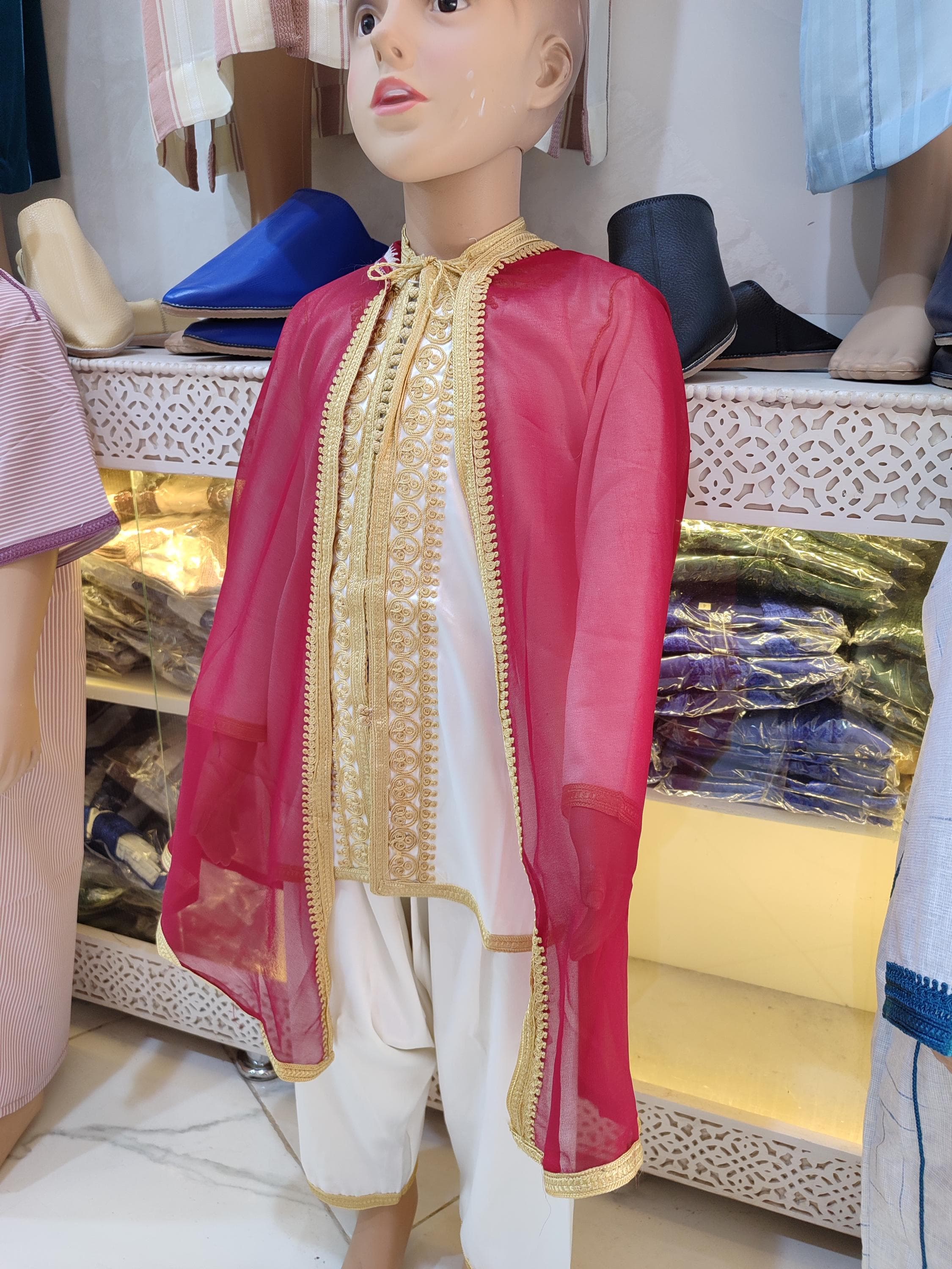 This jabador baby boy set is specially designed for your little one's milestone celebrations. As a handmade traditional 3-piece outfit, it features the finest chiffon with delicate embroidered accents perfect for aqiqah, first Eid, or photography sessions. The Moroccan jabador kid design prioritizes comfort with soft linings and adjustable features while maintaining authentic style. The matching pieces create a cohesive children chiffon clothing ensemble that photographs beautifully
