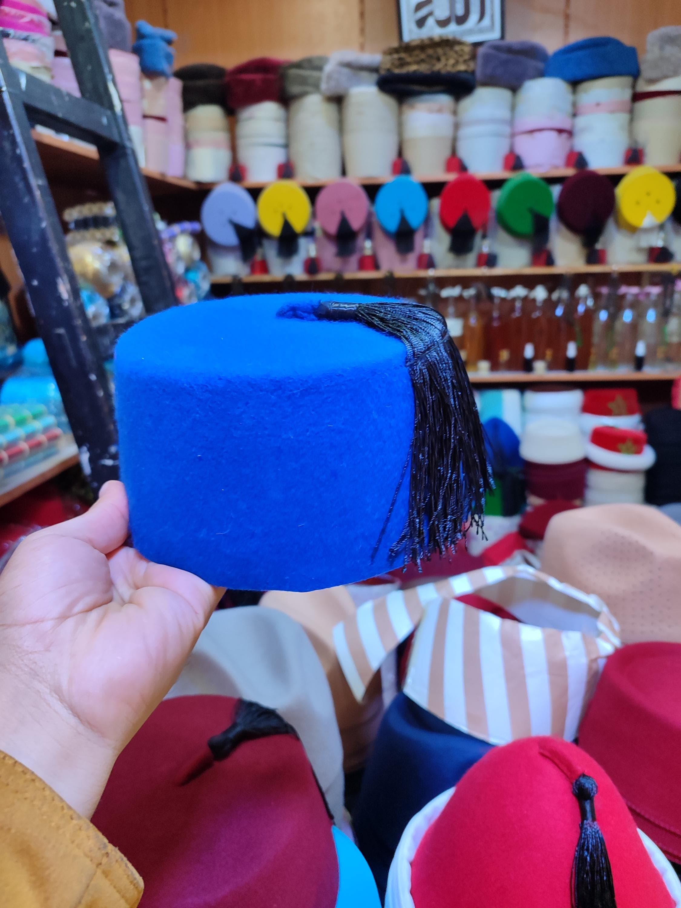 Crafted with exceptional attention to detail, this tarboosh fez showcases authentic Moroccan artistry. The hat features a rich, vibrant red hue and is finished with a precisely knotted silk tassel that adds a touch of elegance. Ideal for ceremonial events, cultural celebrations, or as a distinguished festival accessory, this tarboosh hat pairs beautifully with both traditional and modern attire. Its handtailored construction ensures a comfortable fit,