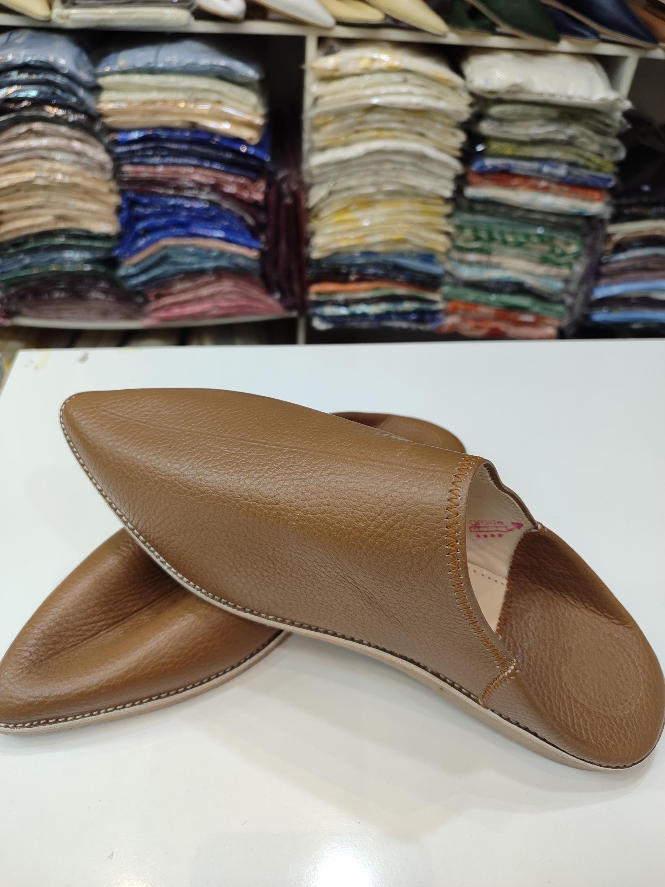 These premium moroccan shoes handmade represent the finest in traditional craftsmanship. Each pair of mens moroccan babouche is carefully cut, hand-dyed, and stitched by master artisans using techniques passed down through generations . The pointed toe leather mules feature soft, breathable leather lining that ensures all-day comfort . Perfect as eid gift men options for Eid al-Fitr celebrations or ramadan outfit shoes for evening prayers,