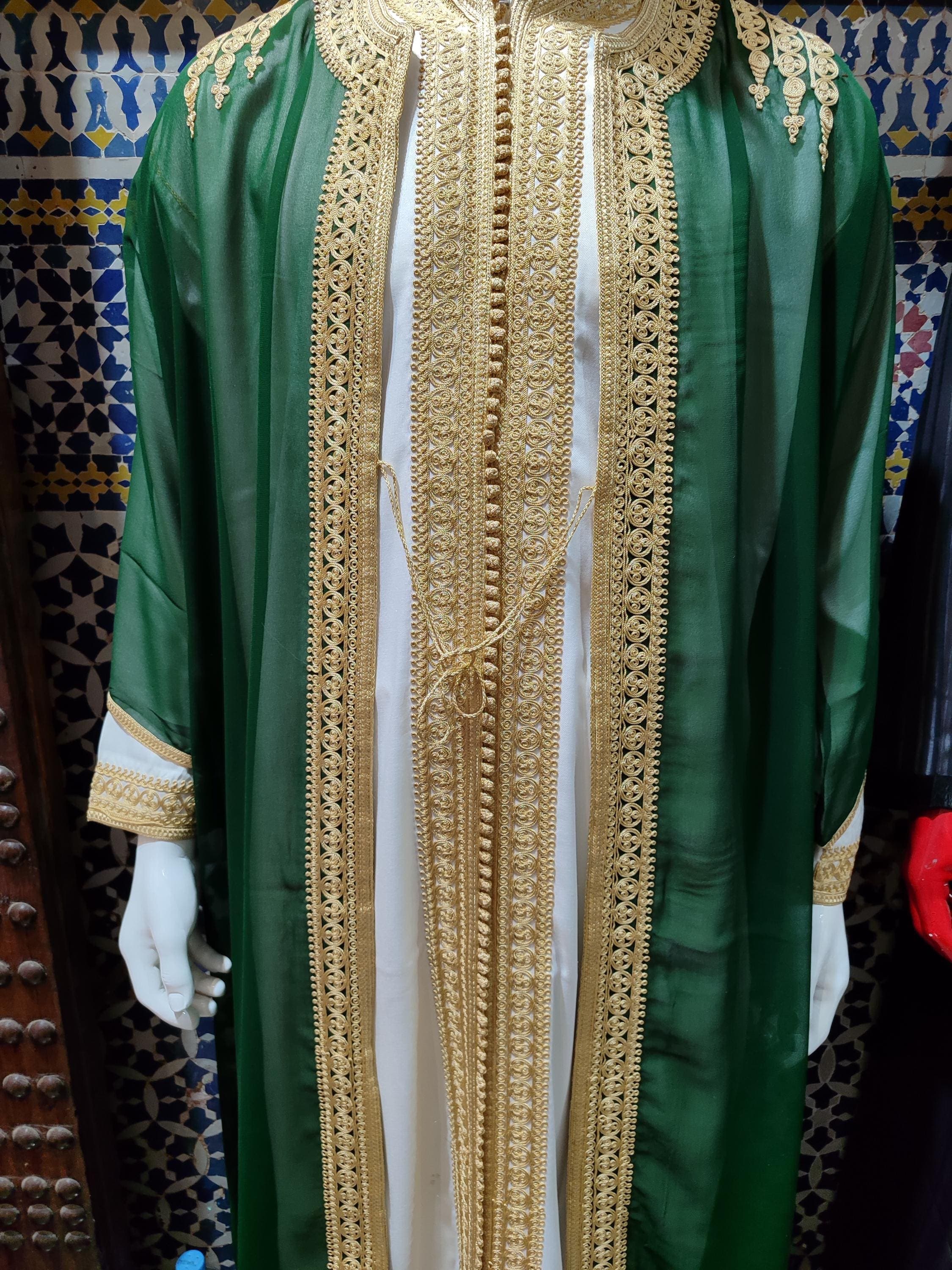 This Moroccan jabador is designed for moments that matter—Nikah ceremonies, Ramadan gatherings, or Eid celebrations. The luxury jabador set features three pieces with exquisite gold embroidery on rich green fabric. It’s a timeless expression of traditional Moroccan clothing, combining the sophistication of men’s kaftan and the comfort of a thobe. A unique choice for modern men embracing heritage.