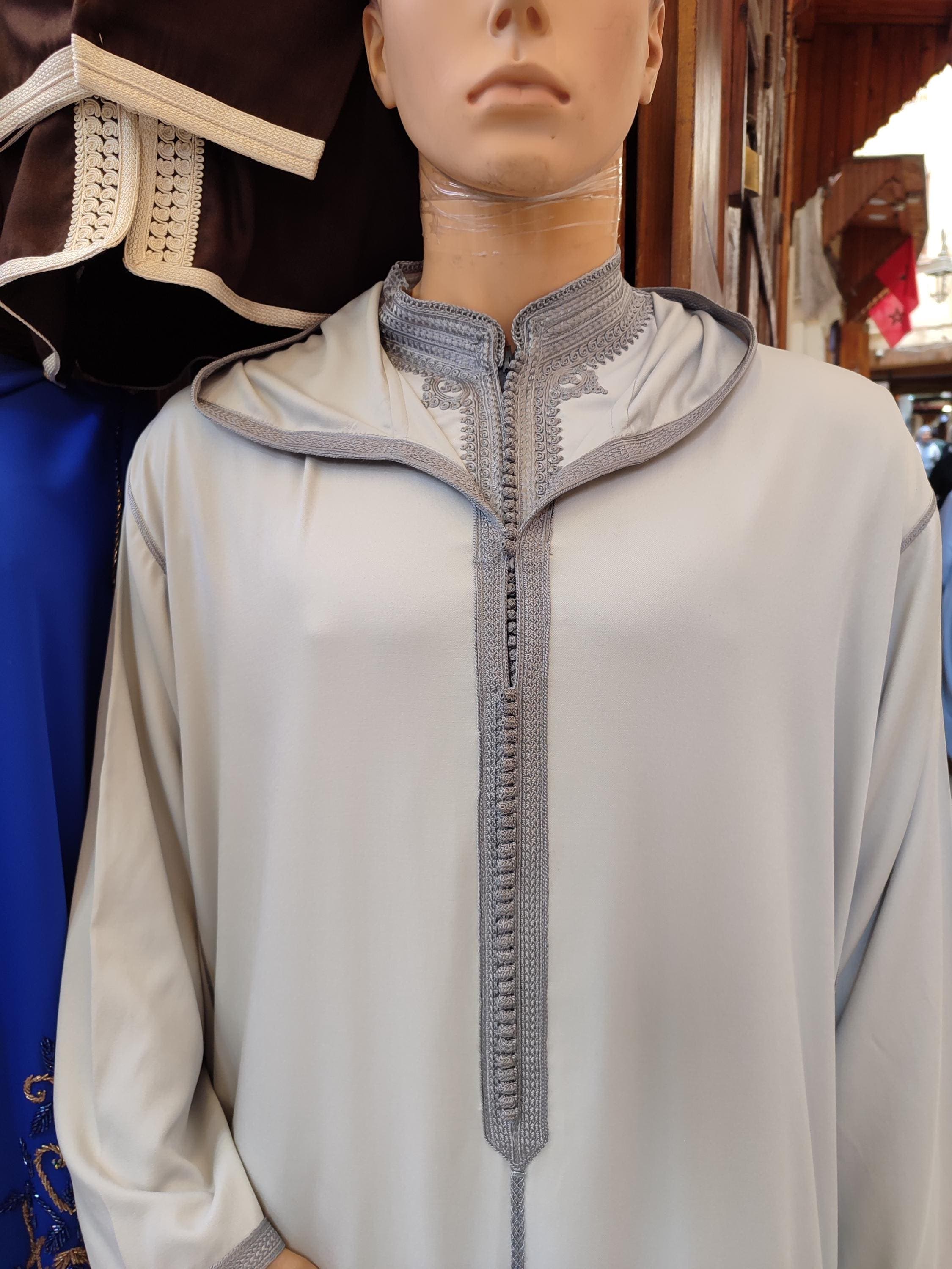 This Moroccan djellaba is a winter essential for the modern Muslim man. Designed in thick wool for warmth and crafted by artisans, it's ideal as a djellaba man or wool jalabiya men piece. Whether used as a thawb, jubah, or elegant mens kaftan dress, it’s suited for weddings or Friday prayers. A thoughtful gift for husband that reflects Moroccan elegance and Berber tradition with every stitch.