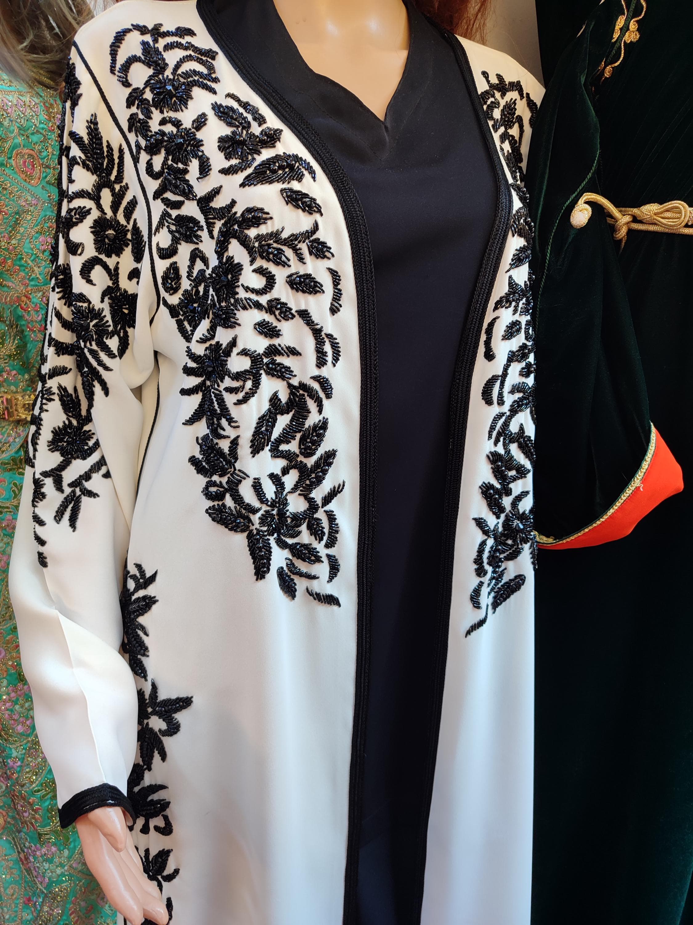 Discover the versatility of our women jellaba collection, where traditional Moroccan craftsmanship meets contemporary modest fashion. Each embroidered jellaba is a testament to the artistry of djellaba handmade techniques, featuring intricate detailing on premium fabrics. Our jellaba for women designs range from everyday moroccan outfit options to elaborate evening wear, all maintaining the authentic character of traditional djellabas while incorporating modern elements.