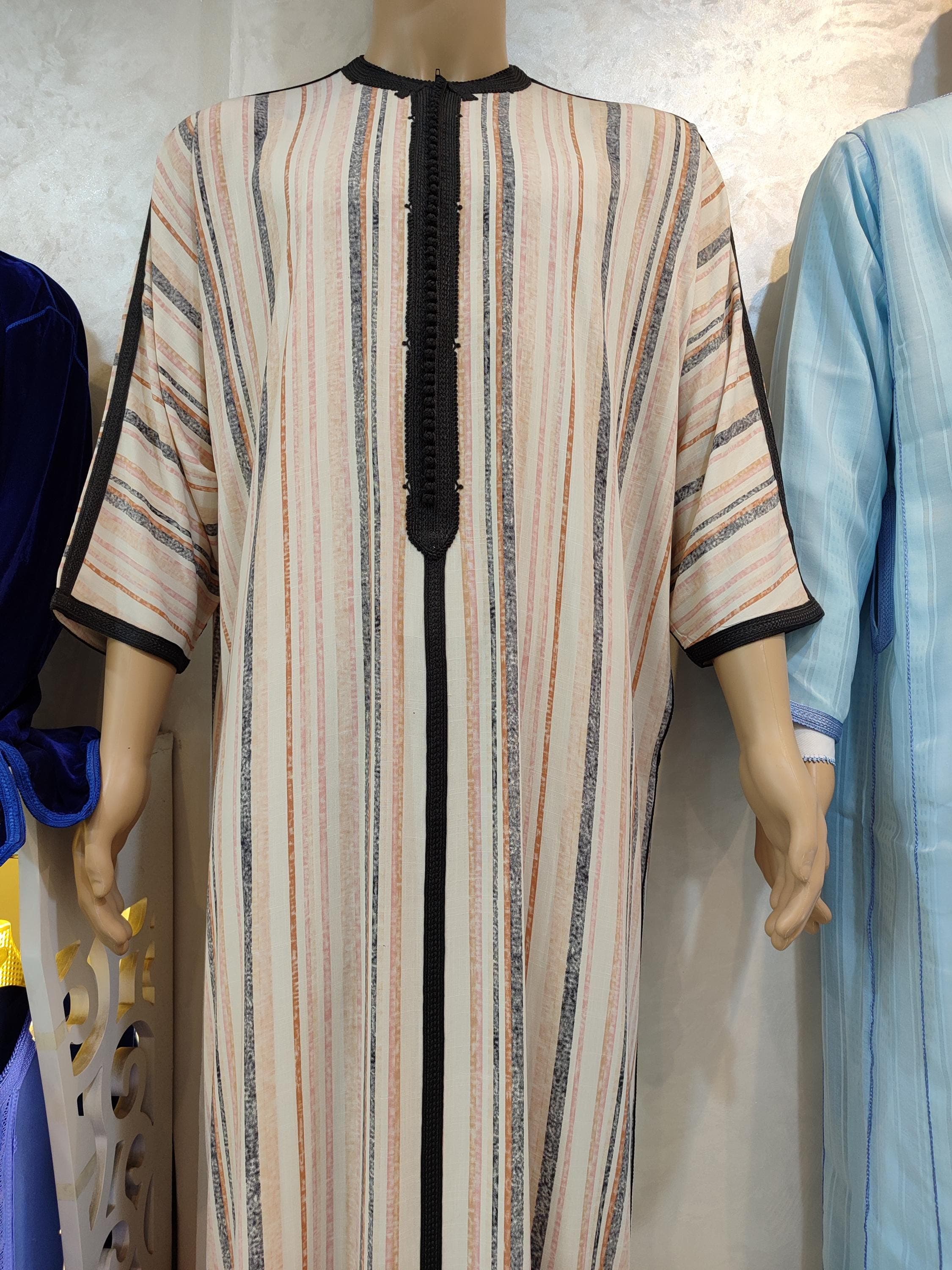 Elegance meets spirituality in this linen kaftan for man a lightweight and breathable version of the classic djellaba man. Its minimalist design takes cues from both the qamis and maxi kaftan for man, offering a perfect balance of modesty and style. Ideal for summer prayers, Friday mosque, or simply relaxing at home, it’s a must-have for men who appreciate traditional garments with modern comfort.