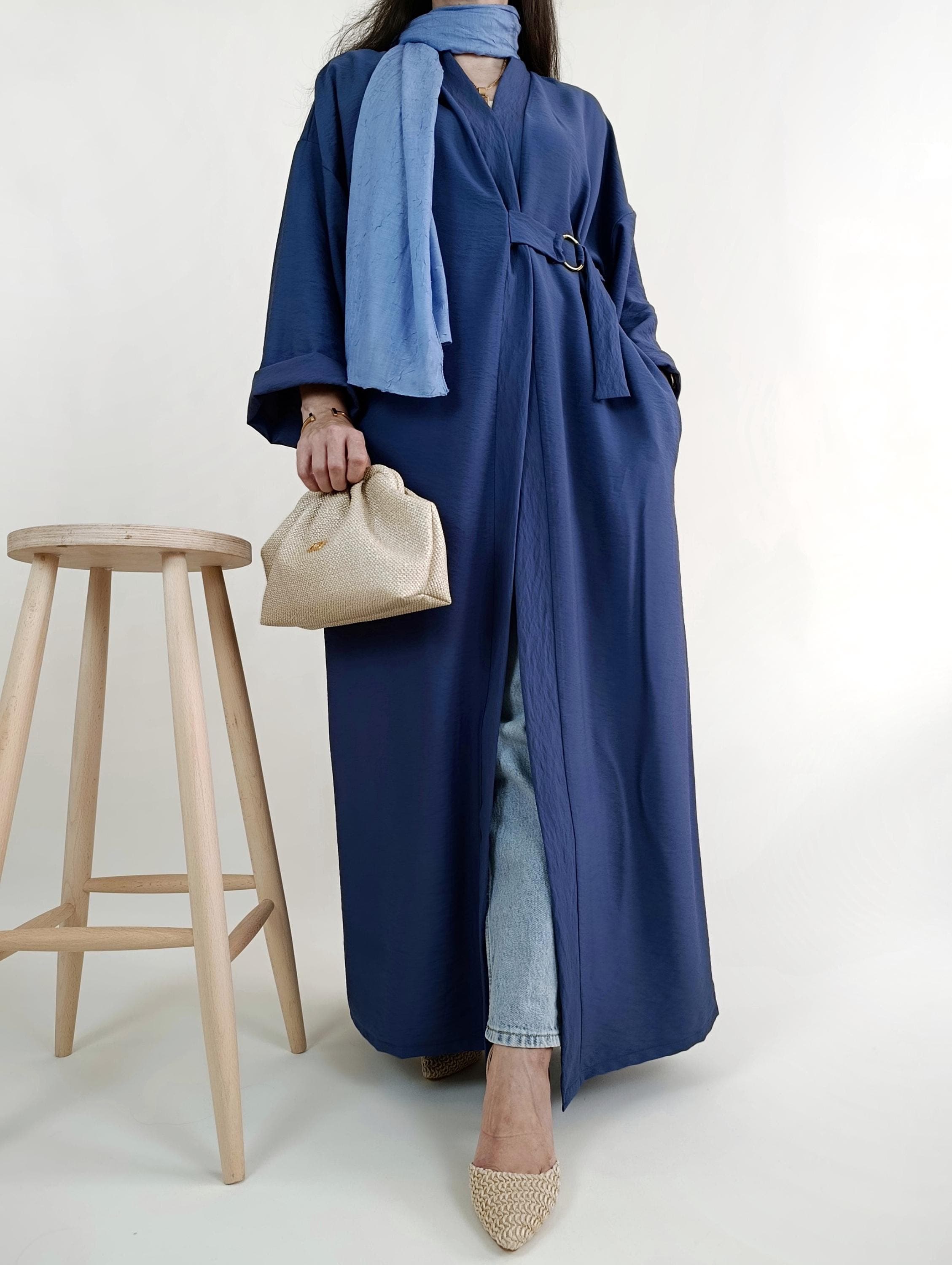 Luxury abaya-inspired kimono coat with gold belt, modern and versatile design.