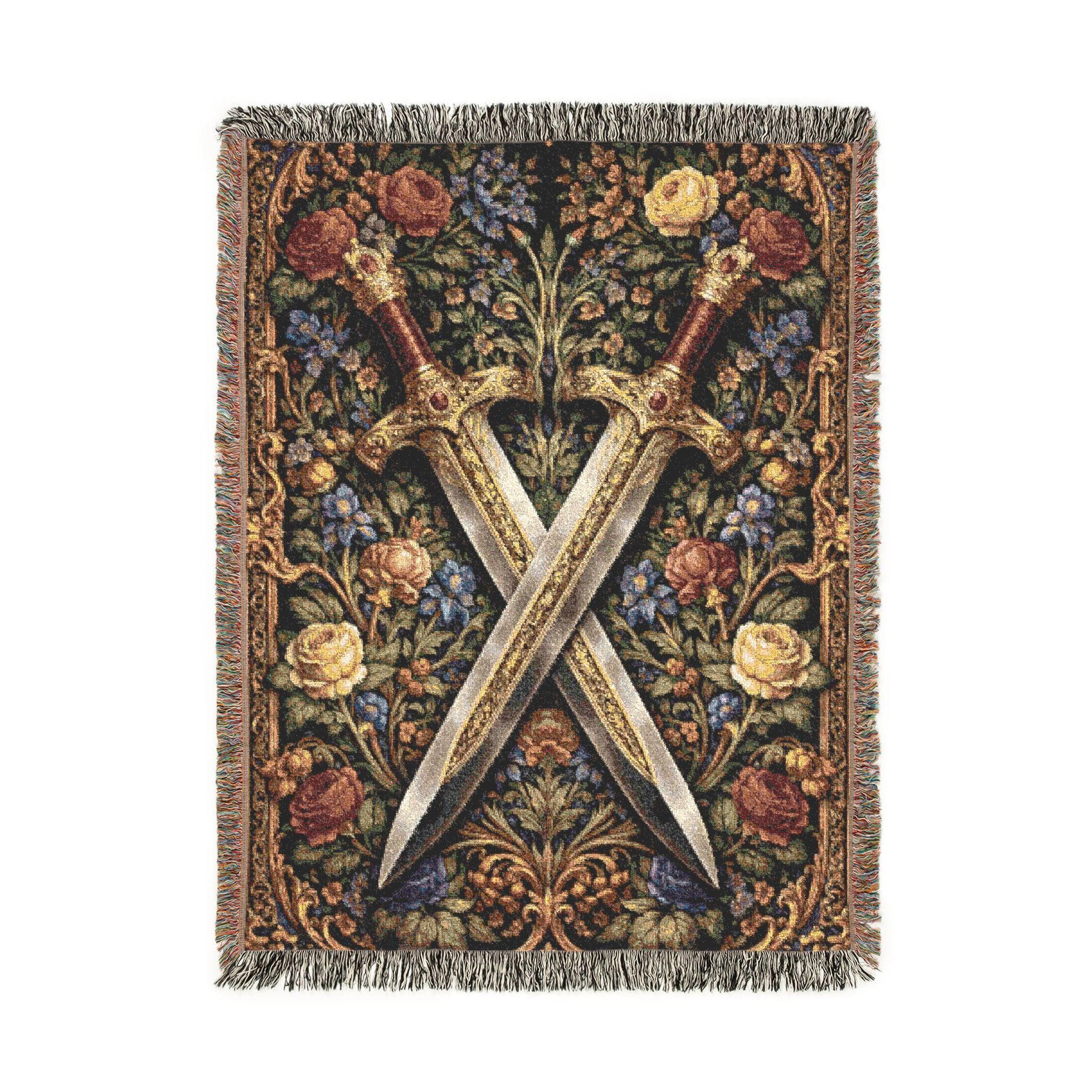 Woven tapestry wall hanging featuring two crossed ornate medieval swords over a floral botanical background with antique gold border details and rich vintage texture. Gothic floral medieval wall decor with deep black, gold, burgundy, ivory, and dusty blue tones, ideal for dark academia bedroom, office, library, game room, or fantasy inspired home. Also works as a woven throw blanket. Perfect gift for sword collectors, fantasy lovers, gothic decor fans, and antique botanical wall art collectors