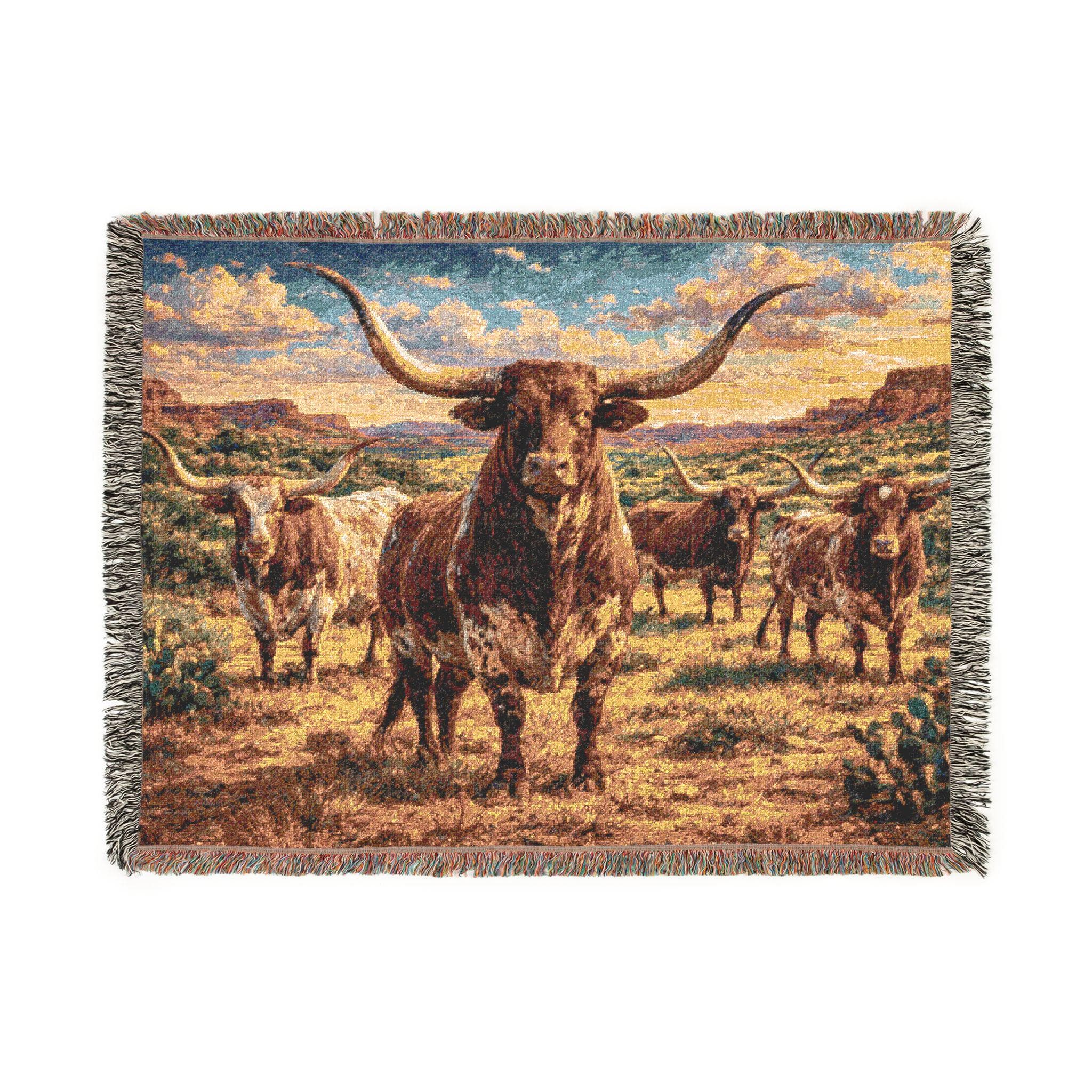 Horizontal jacquard woven tapestry blanket featuring Texas longhorn cattle in a western ranch landscape under a warm sunset sky. Rustic Southwest wall decor with earthy browns, golden grass tones, and soft blue clouds, finished with classic fringe and vintage woven texture. Use as a tapestry wall hanging for living room, bedroom, entryway, cabin or ranch house, or as a cozy woven throw blanket on a bed or chair. Ideal gift for western decor lovers, ranch owners, Texas fans, farmhouse home style