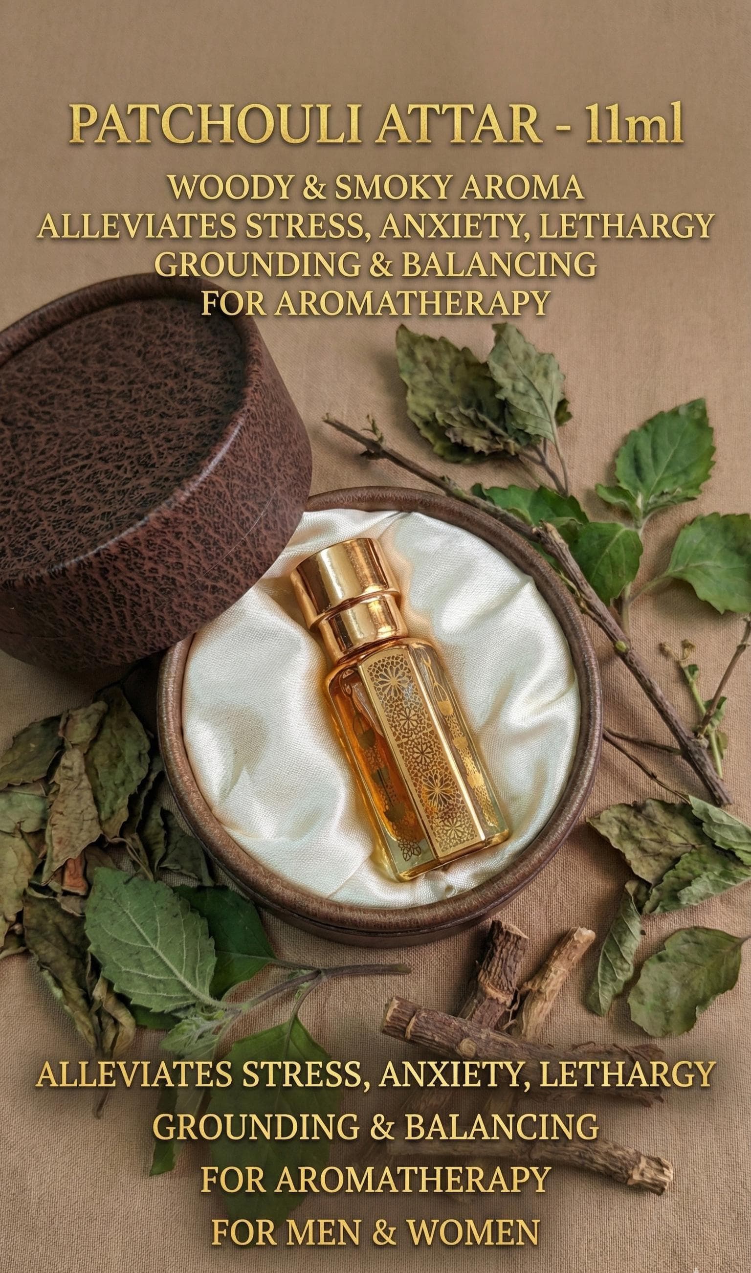 A premium flat-lay ad showing the decorative 11ml attar bottle in its satin-lined case. The bottle is surrounded by fresh green leaves and small, delicate purple patchouli flowers (Pogostemon cablin). Elegant gold typography lists the benefits: alleviating stress, anxiety, and lethargy, while stating it is suitable for both men and women.