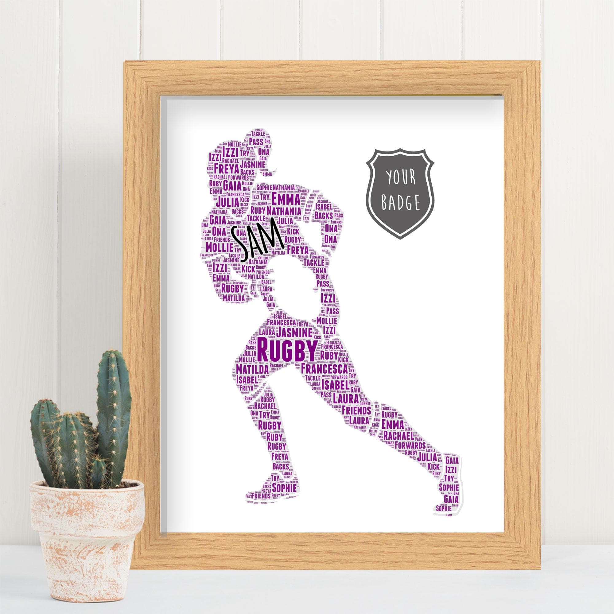 A custom word art print featuring a silhouette of a female rugby player in action, running with a rugby ball. The figure is filled with colourful personalised typography, including names and rugby-themed words. The artwork is presented in high-quality wooden frames including Black Wood and Deep French Oak.
